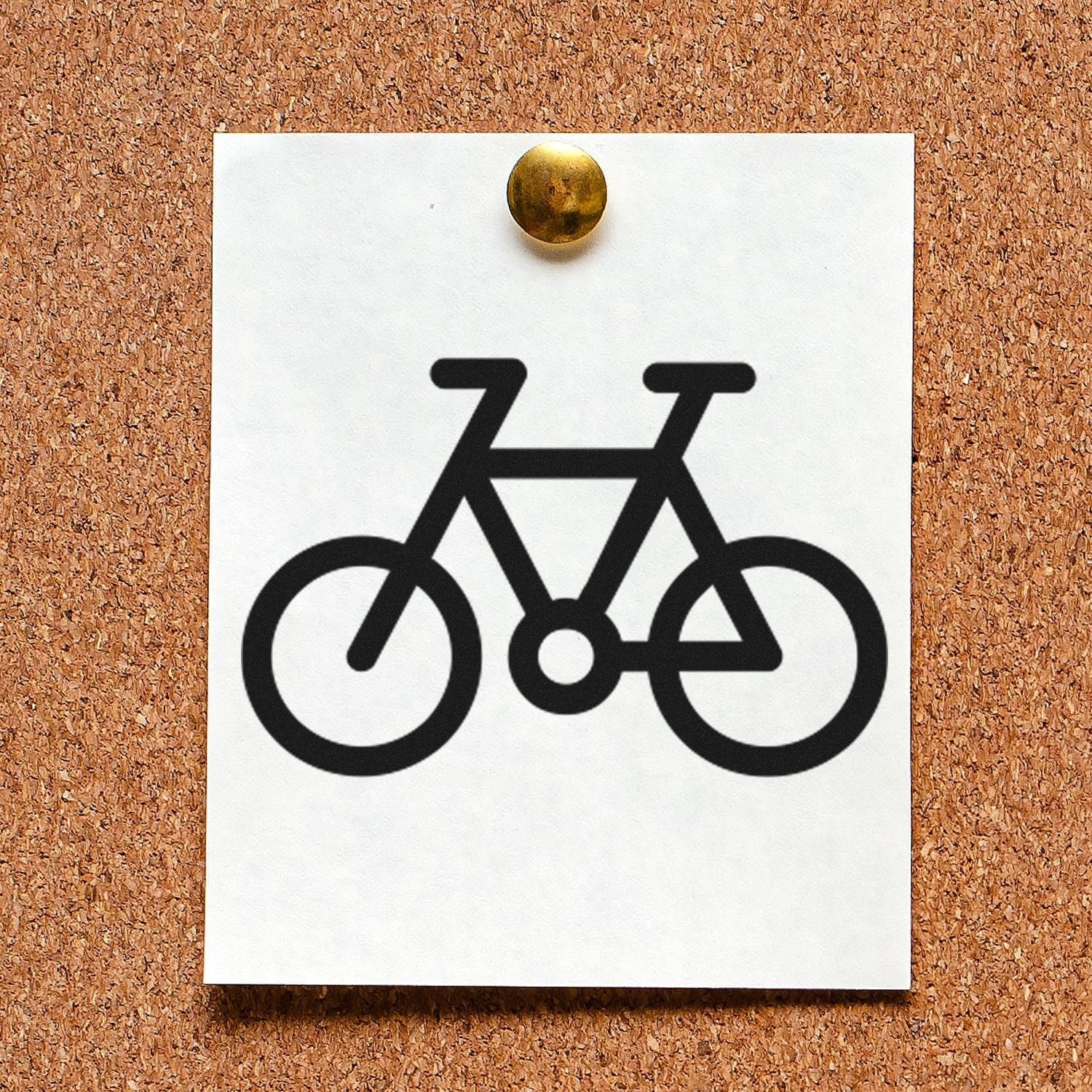 Self-Inking Cycle Of Loyalty Stamp on corkboard, featuring a black bicycle icon on white paper. Perfect for businesses to mark customer loyalty.