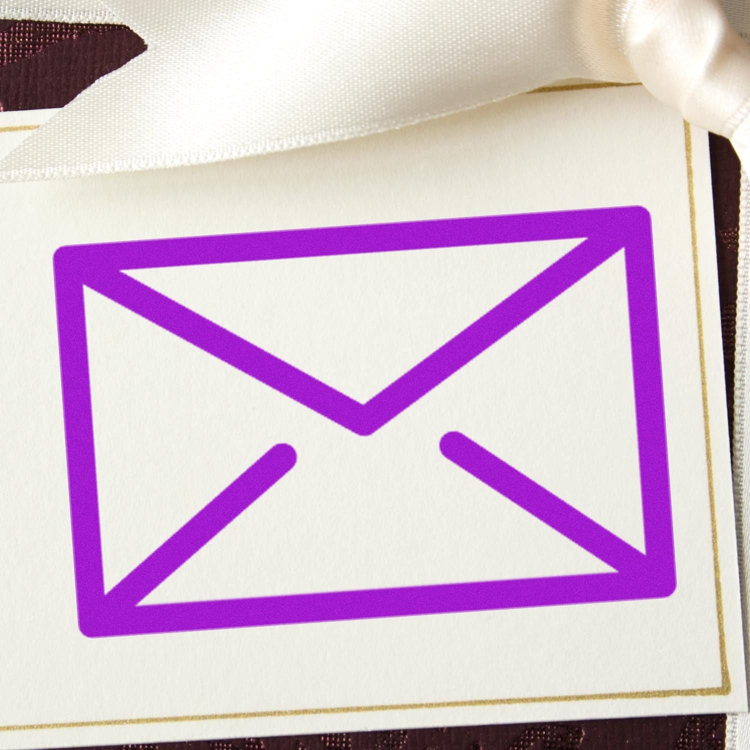 Self-Inking Mail Magic Reward Stamp with a vibrant purple envelope design on a white background, perfect for adding a fun touch to mail and documents.