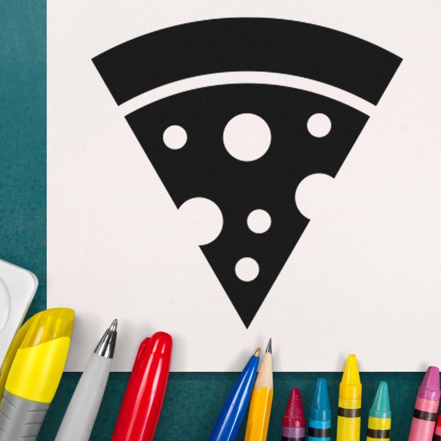 Wood Handle Pizza Perks Incentive Rubber Stamp featuring a black pizza slice design on white paper, surrounded by colorful pens and pencils. Perfect for adding a fun touch to your projects.