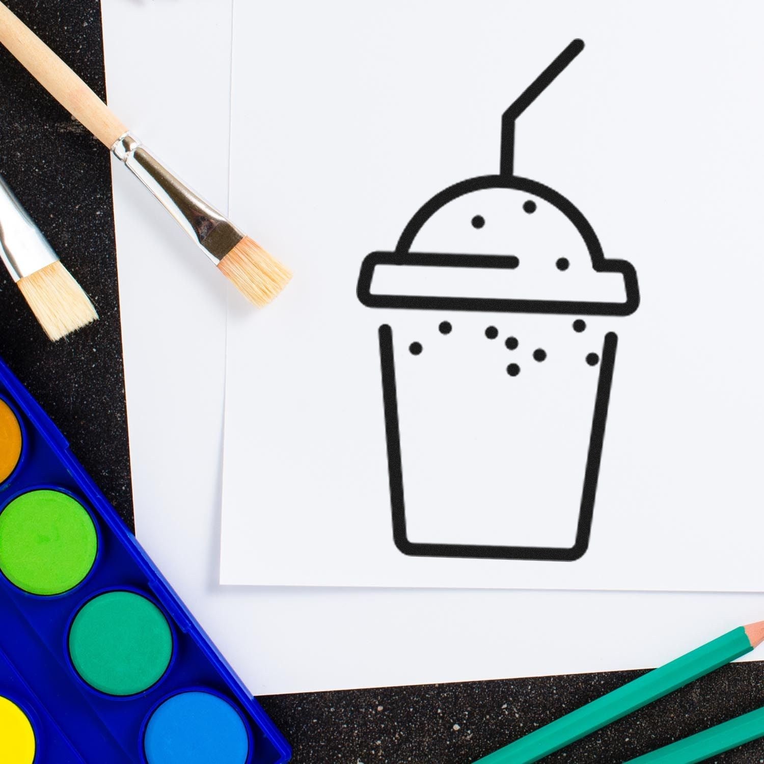 Self-Inking Shake Membership Stamp with a shake cup design, shown on white paper. Includes paintbrushes and watercolor set, ideal for creative projects and personalized stamping.