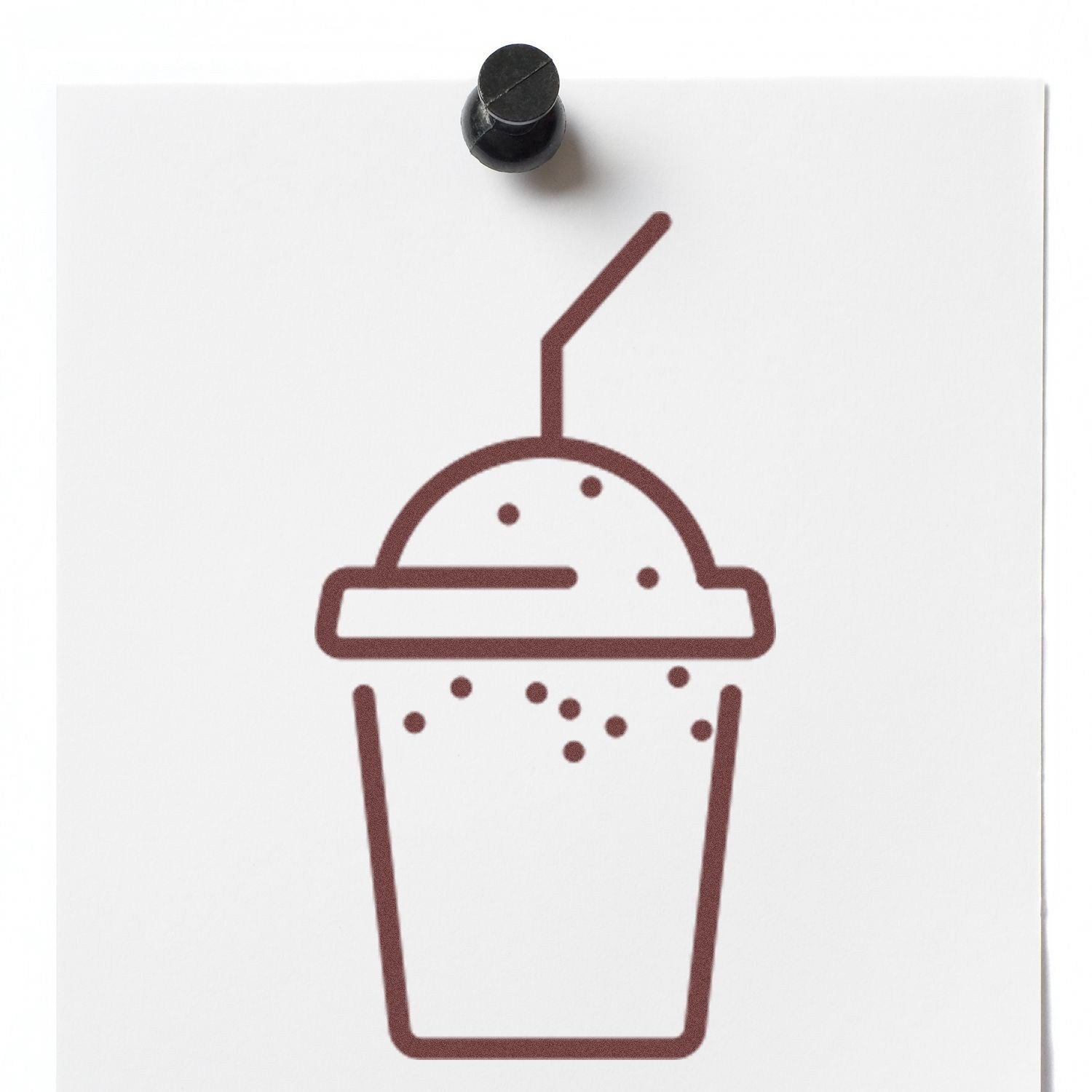 Image of a Self-Inking Shake Membership Stamp featuring a brown shake cup design on white paper, pinned to a board. Perfect for clubs and loyalty programs.