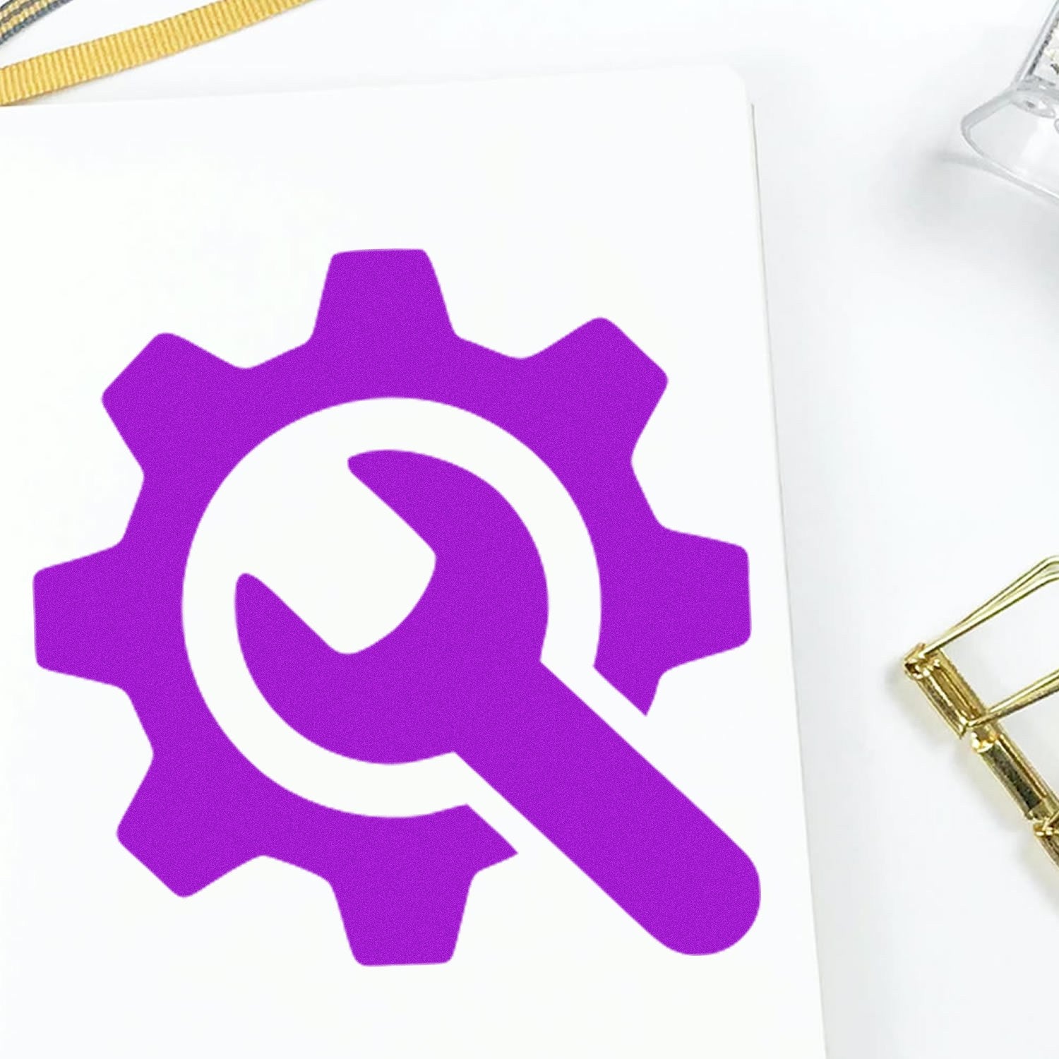 Image of a Wood Handle Tool Reward Program Rubber Stamp featuring a purple gear and wrench design on a white surface, highlighting its unique craftsmanship and functionality.