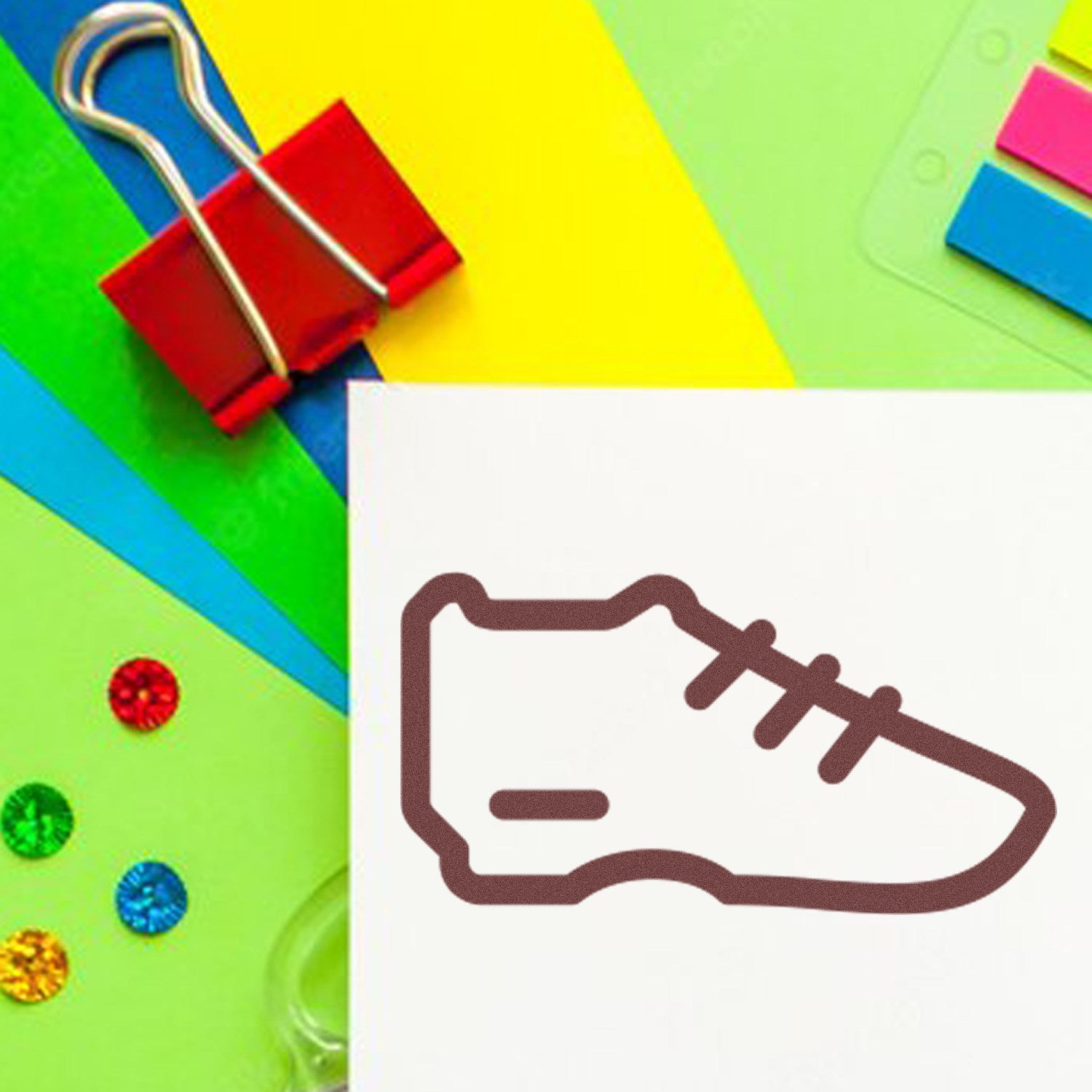 Wood Handle Sneaker Reward Rubber Stamp on colorful paper background, featuring a sneaker design. Ideal for crafting and educational use.