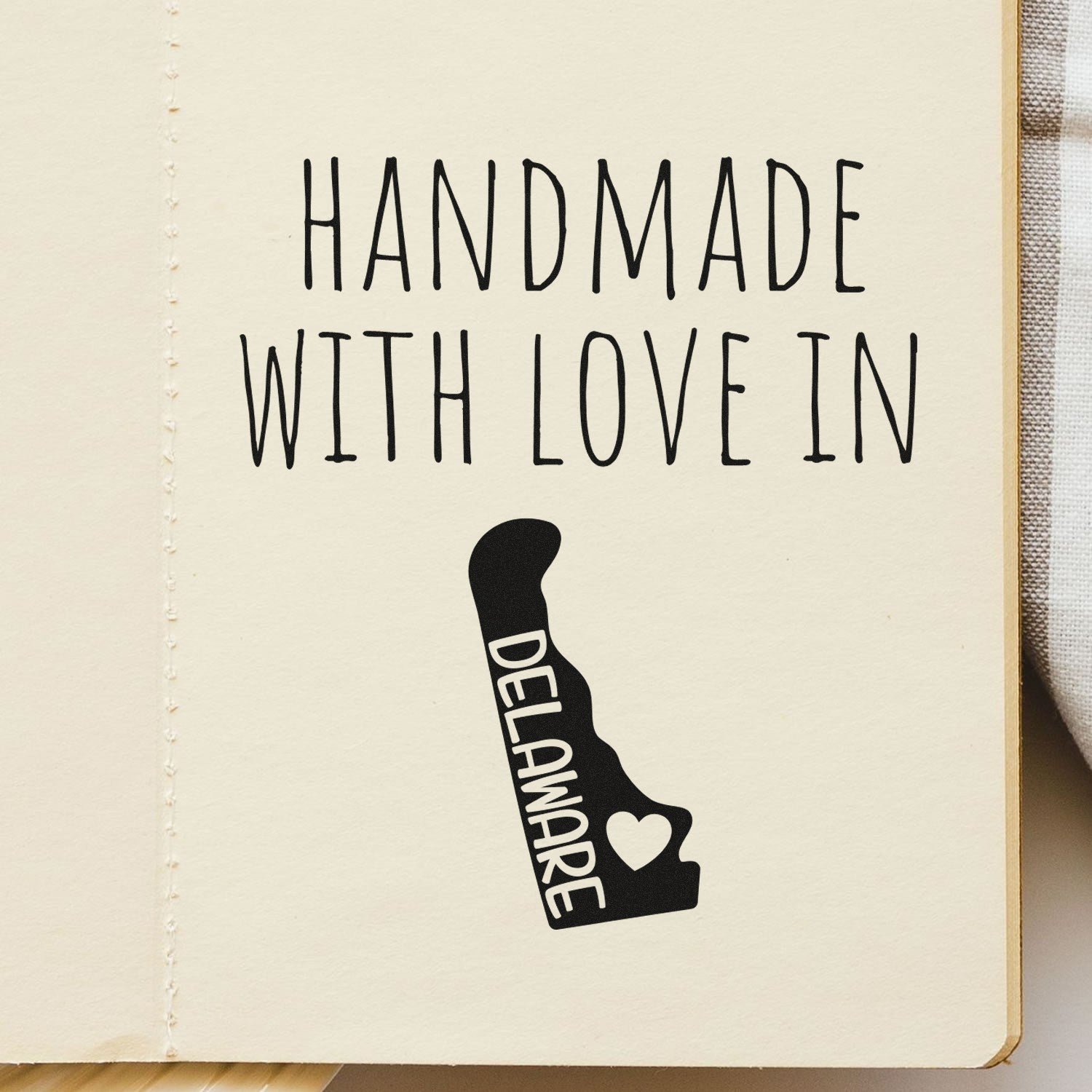 Wood Handle Delaware Handmade with Love Rubber Stamp on paper, featuring Handmade with Love in Delaware text and state outline with heart. Perfect for crafts and personalized projects.