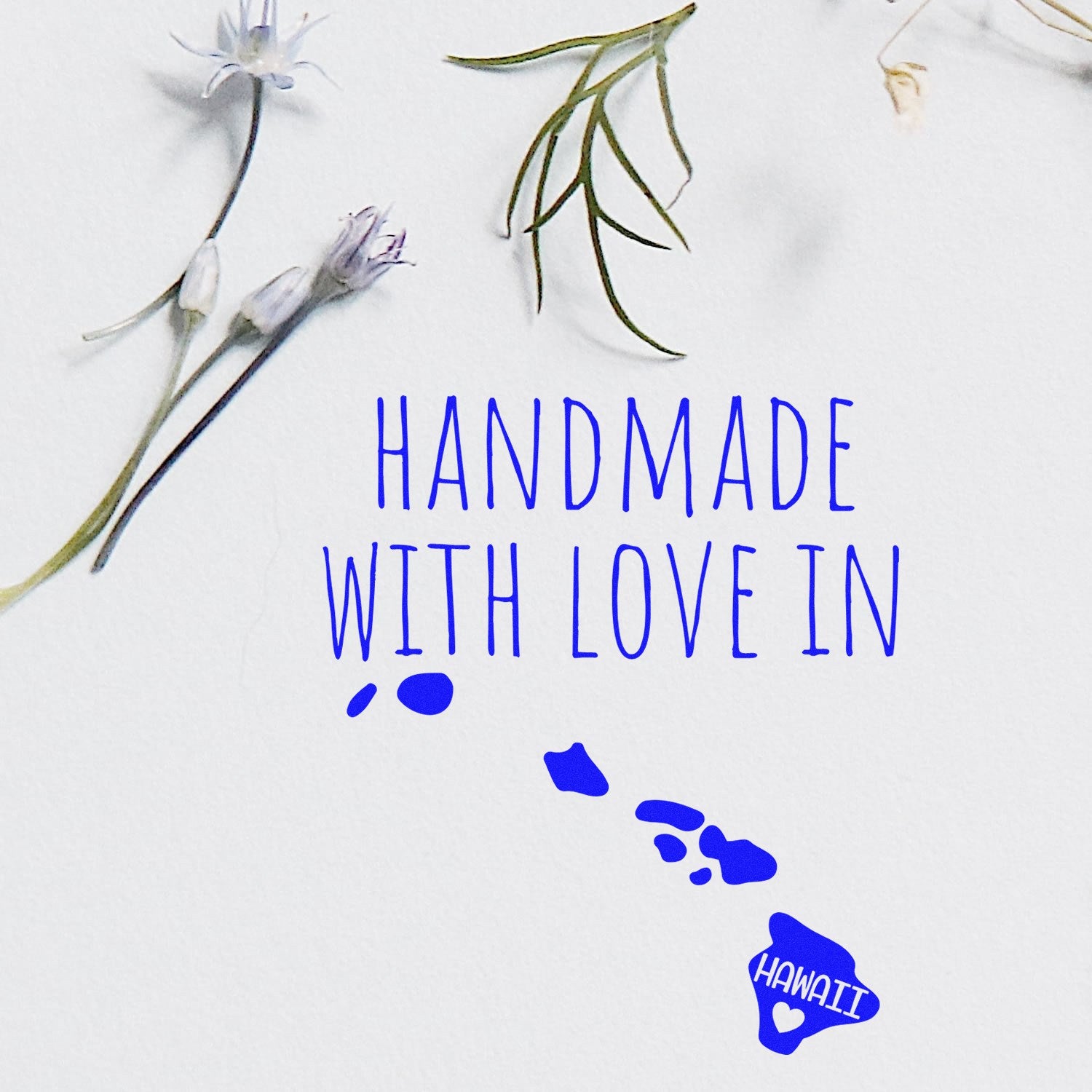 Self-Inking Hawaii Handmade with Love Stamp featuring blue text and floral accents, perfect for adding a personal touch to crafts and gifts.