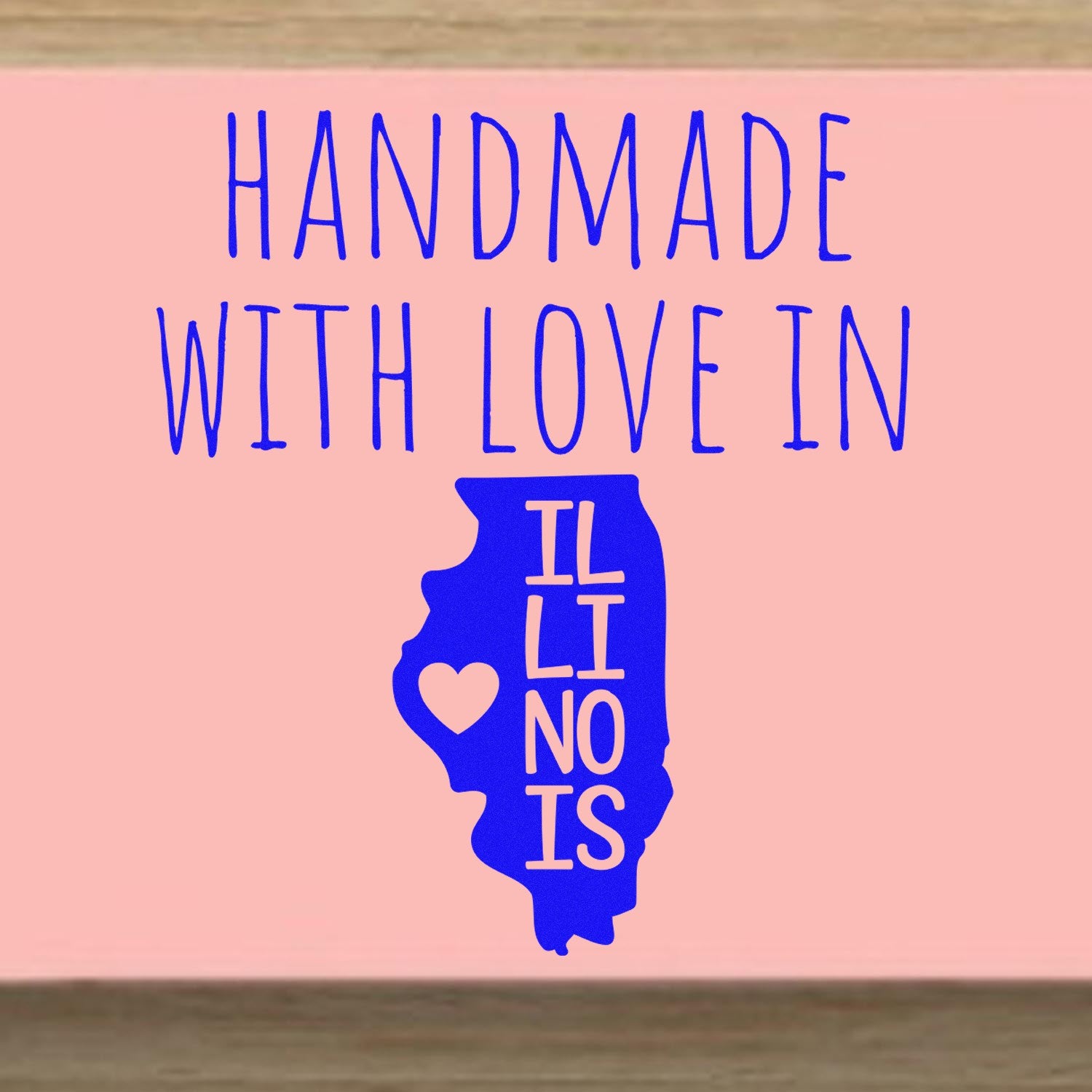 Self-Inking Illinois Handmade with Love Stamp featuring a blue Illinois state outline with a heart, and text 'Handmade with Love in Illinois' on a pink background.