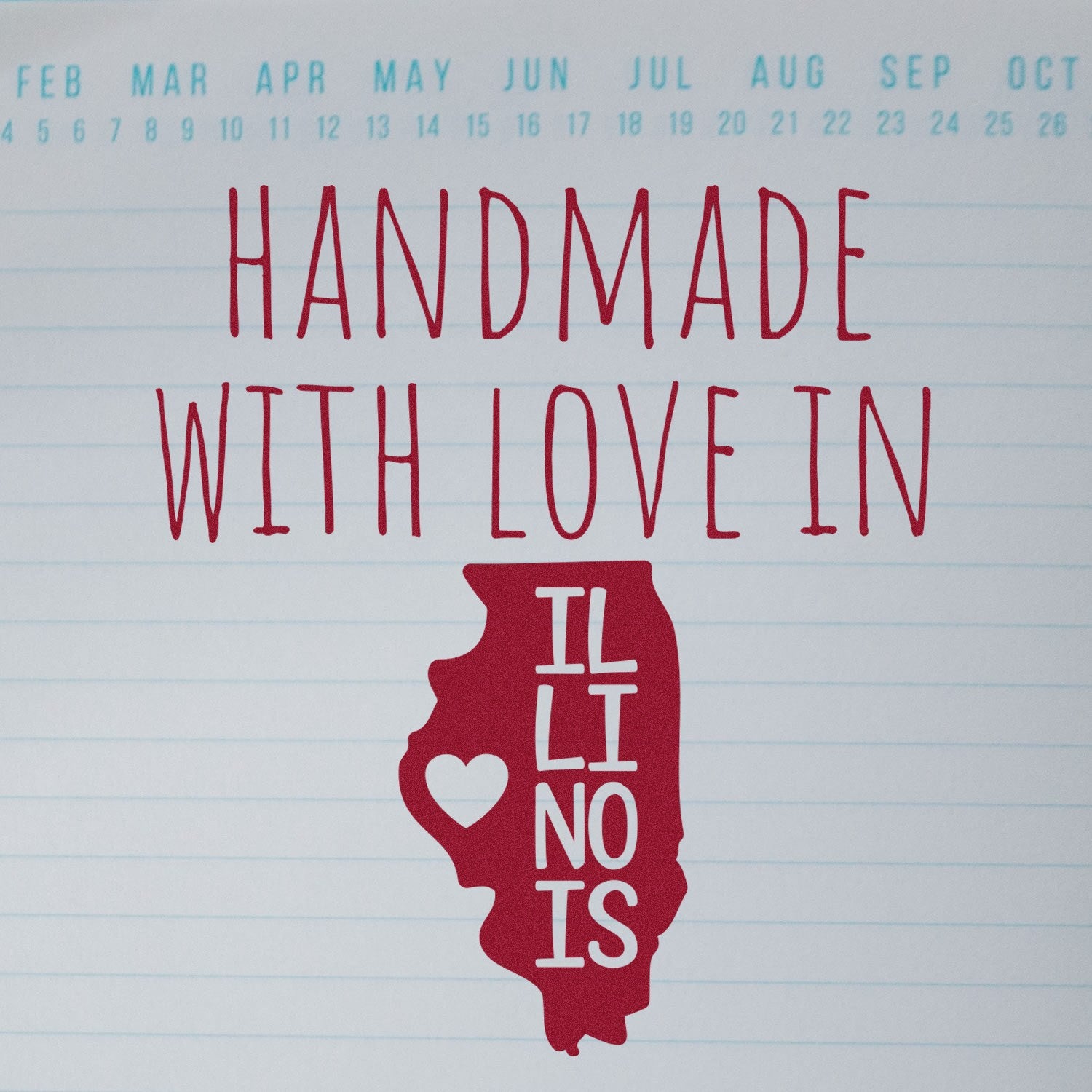 Handmade with Love in Illinois Slim Pre-Inked Stamp featuring a red Illinois state outline with heart, on a lined background with months at the top.