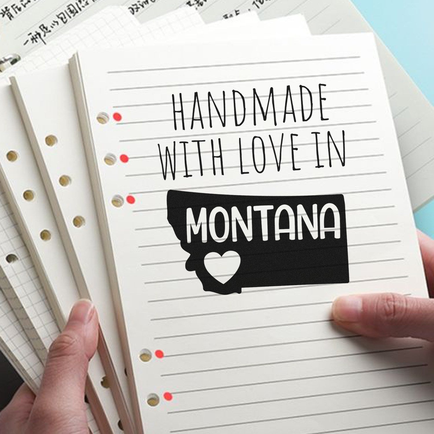 Self-Inking Montana Handmade with Love Stamp on notepad, featuring a black silhouette of Montana with a heart, perfect for adding a personal touch to crafts and letters.