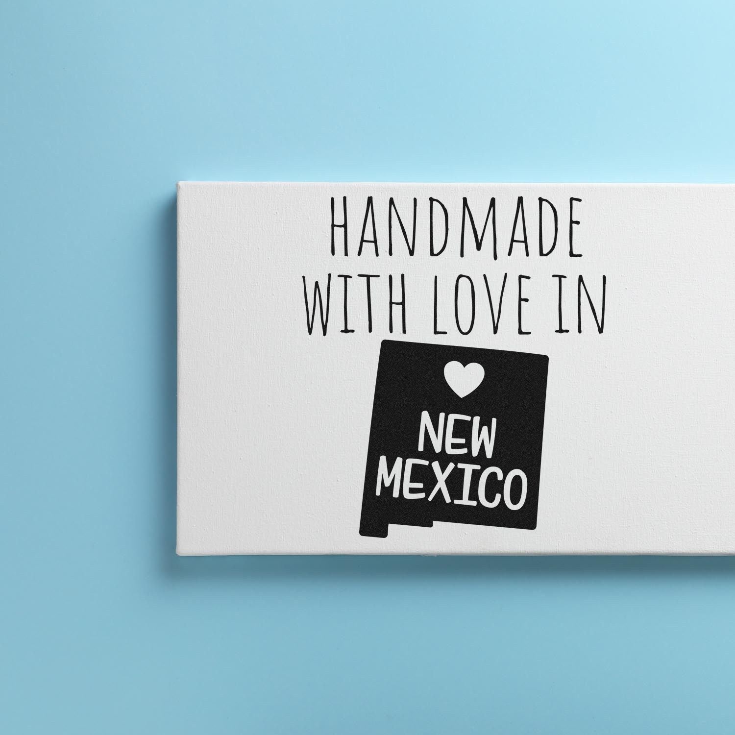 Wood Handle New Mexico Handmade with Love Rubber Stamp on a light blue background, featuring a heart and New Mexico text, perfect for crafts and personalized projects.