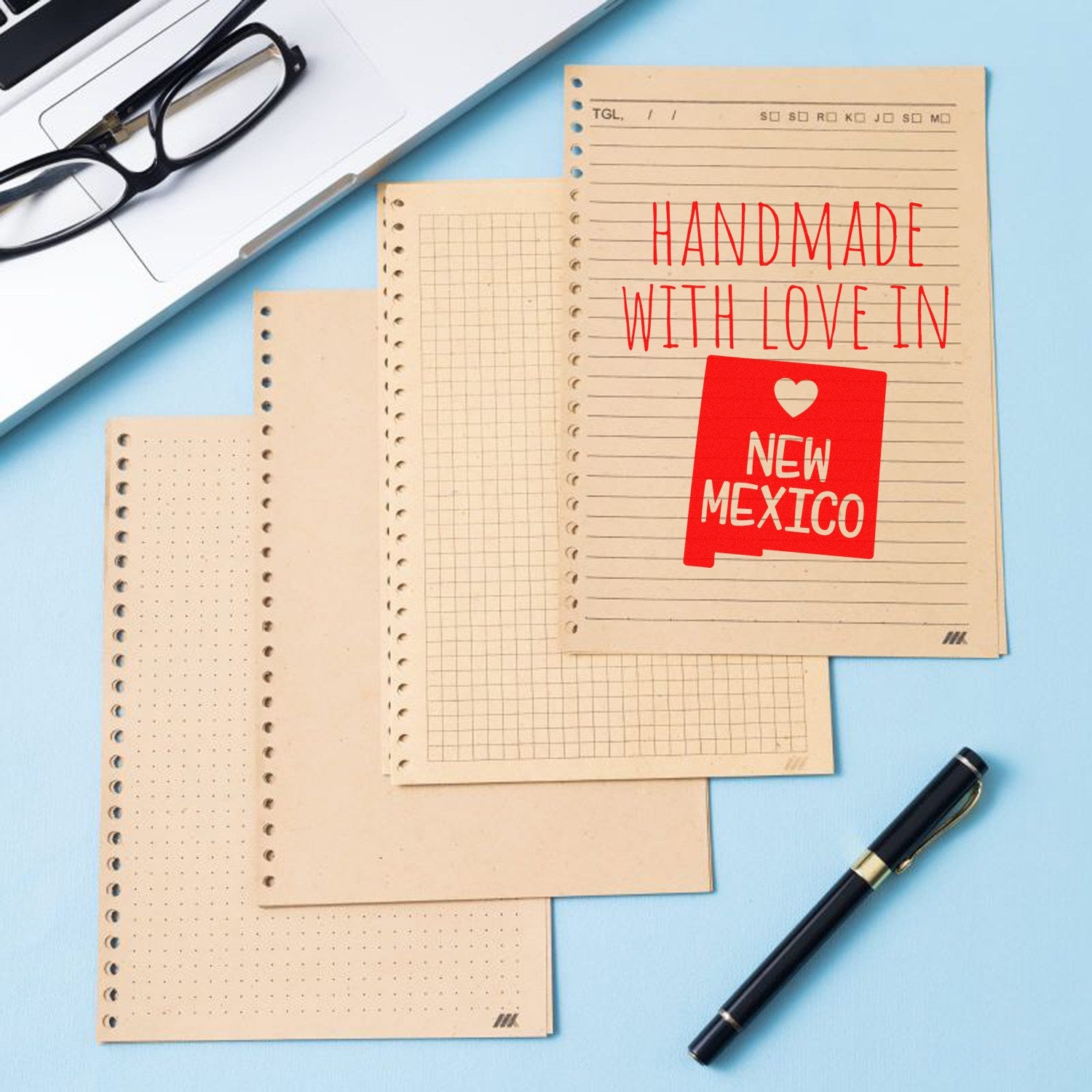 Handmade with Love in New Mexico Slim Pre-Inked Stamp on a notepad, showcasing vibrant red text and heart design, perfect for adding a personal touch to stationery.