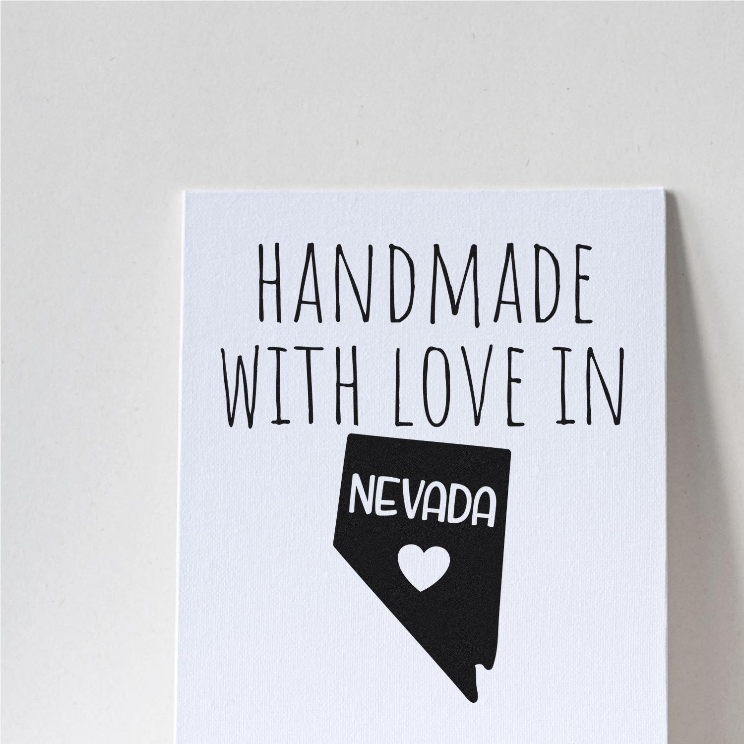 Self-Inking Nevada Handmade with Love Stamp featuring a Nevada state outline with a heart, perfect for adding a personal touch to crafts and gifts.