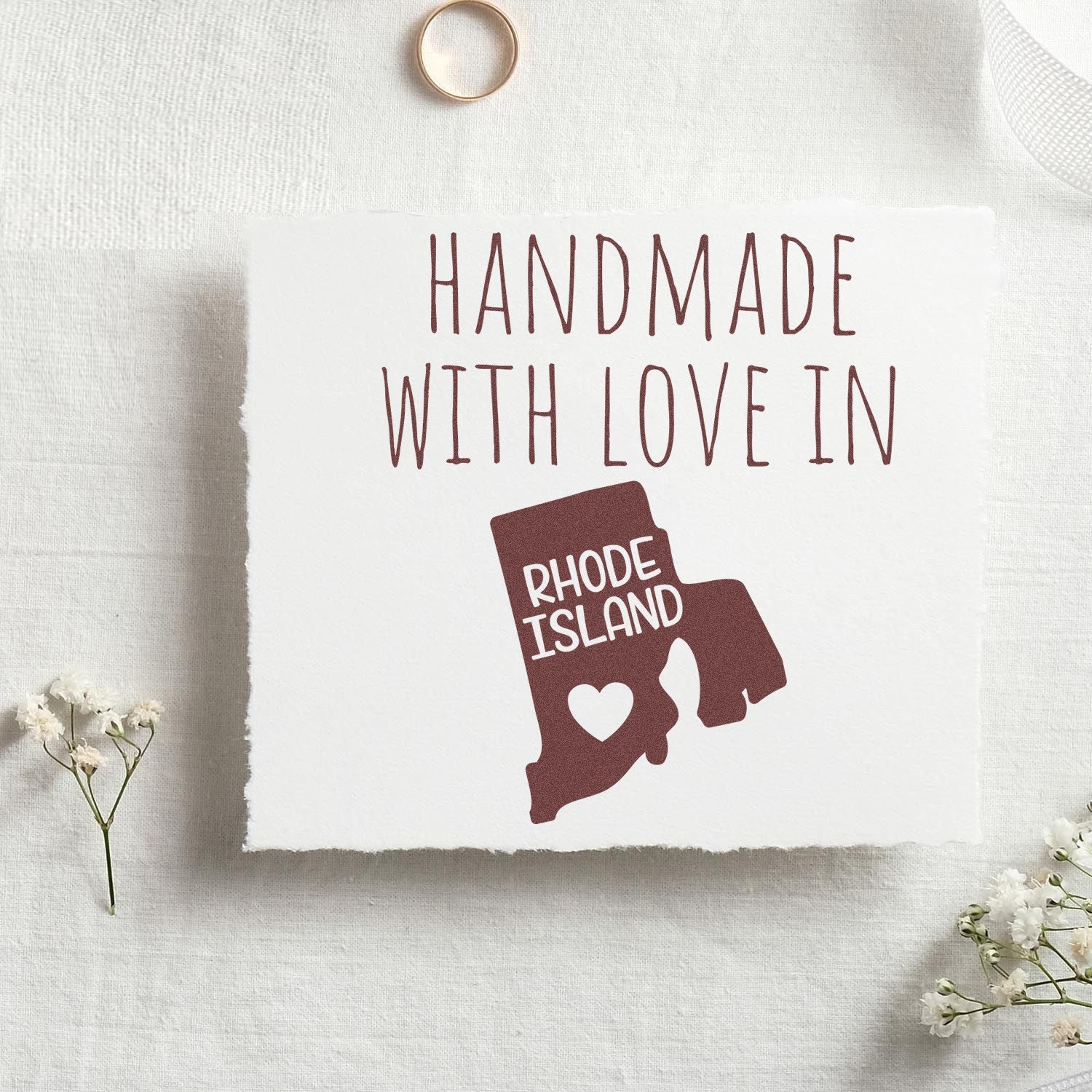 Self-Inking Rhode Island Handmade with Love Stamp featuring a heart design on a white card with flowers and a ring, perfect for crafts and gifts.