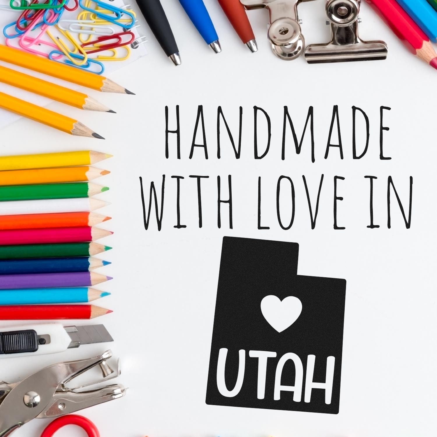 PSI Pre-Inked Handmade with Love in Utah stamp surrounded by colorful stationery, showcasing its unique design and craftsmanship. Perfect for adding a personal touch to your projects.