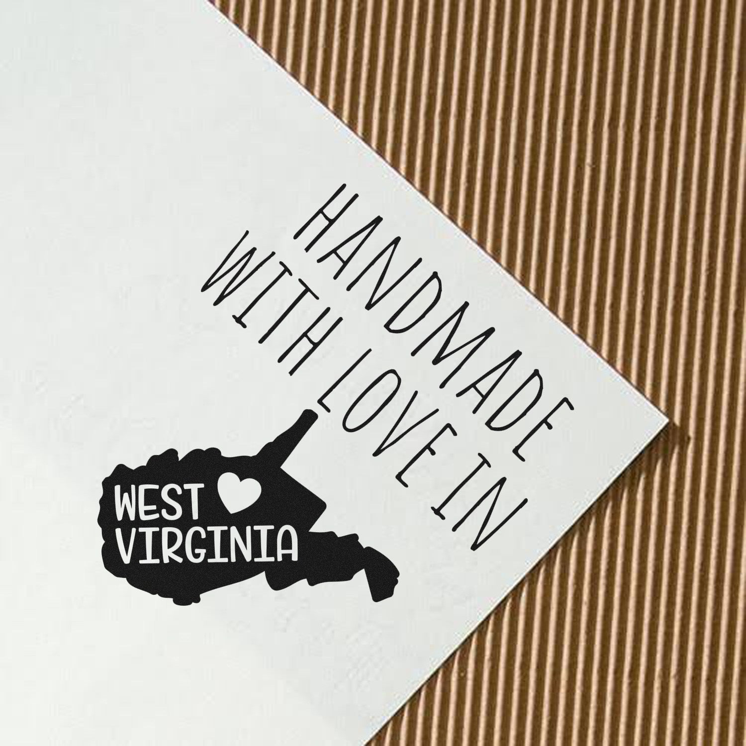 PSI Pre-Inked Handmade with Love in West Virginia stamp on paper, featuring a heart and state outline, showcasing craftsmanship and regional pride.