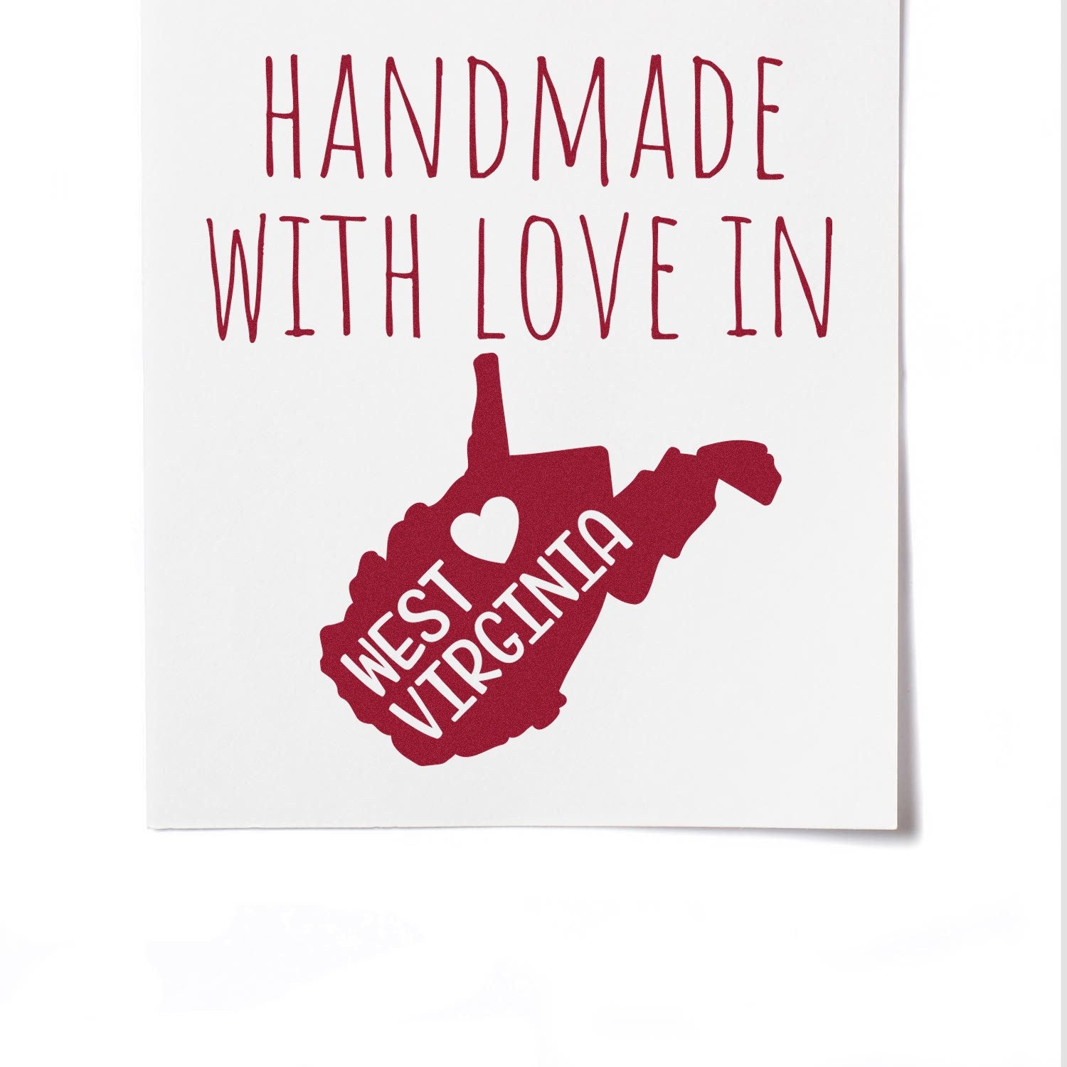 Self-Inking West Virginia Handmade with Love Stamp featuring a red outline of West Virginia with a heart, perfect for crafts and gifts.