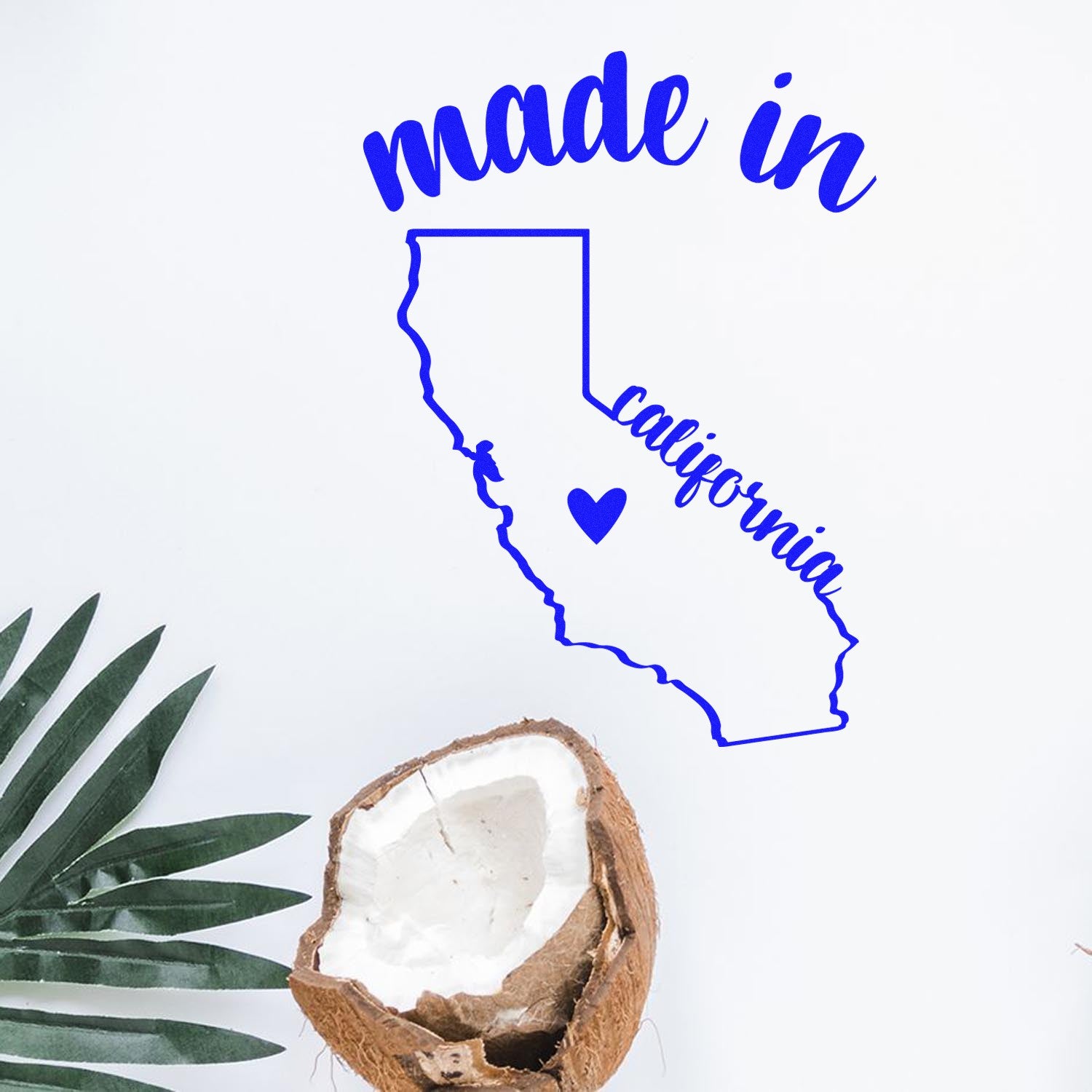 Self-Inking Handmade with Love in California Stamp featuring a blue outline of California with a heart, perfect for crafts. Includes a coconut and palm leaf for a tropical touch.