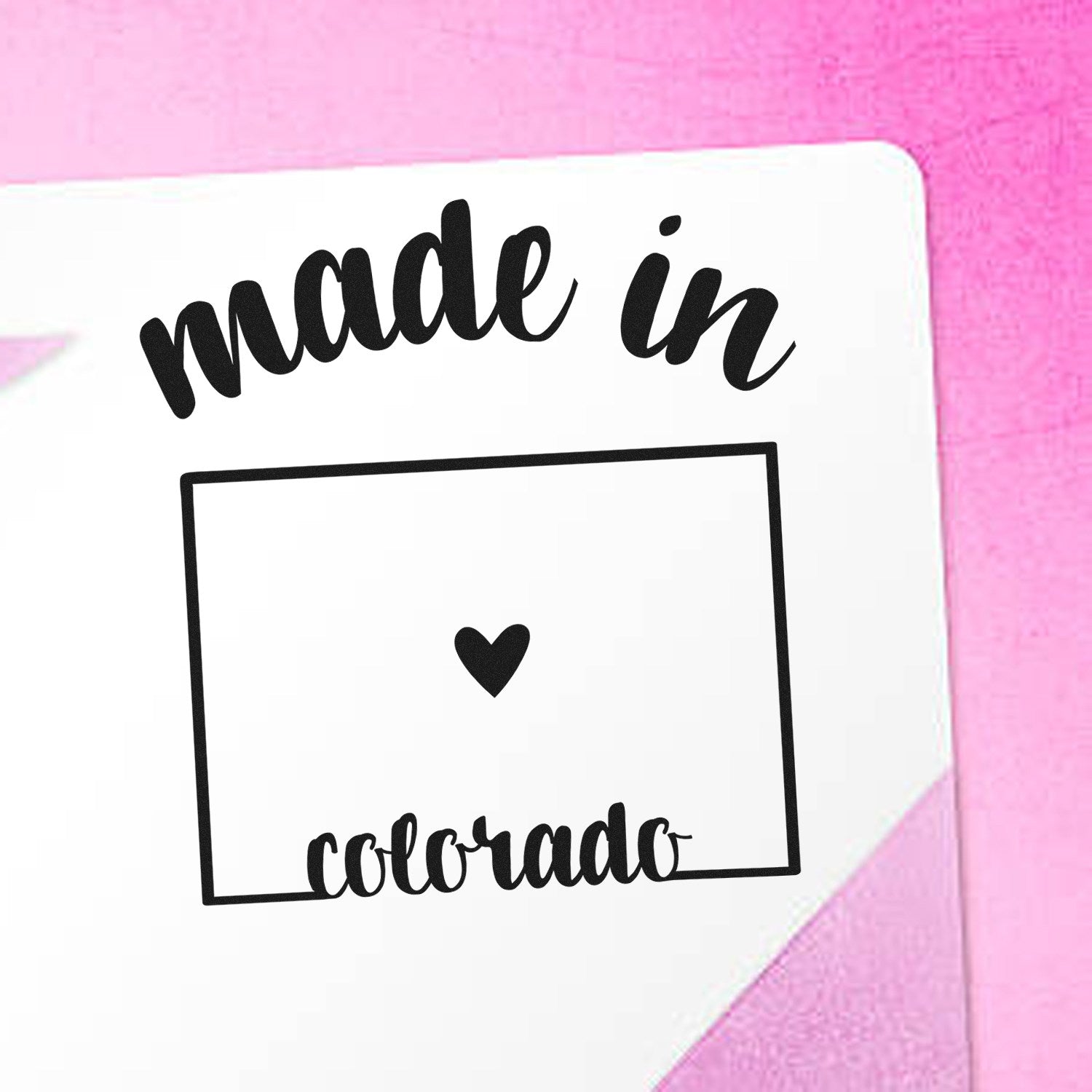 Made with Love in Colorado Rubber Stamp featuring a heart and state outline on a pink background, perfect for adding a personal touch to crafts and gifts.