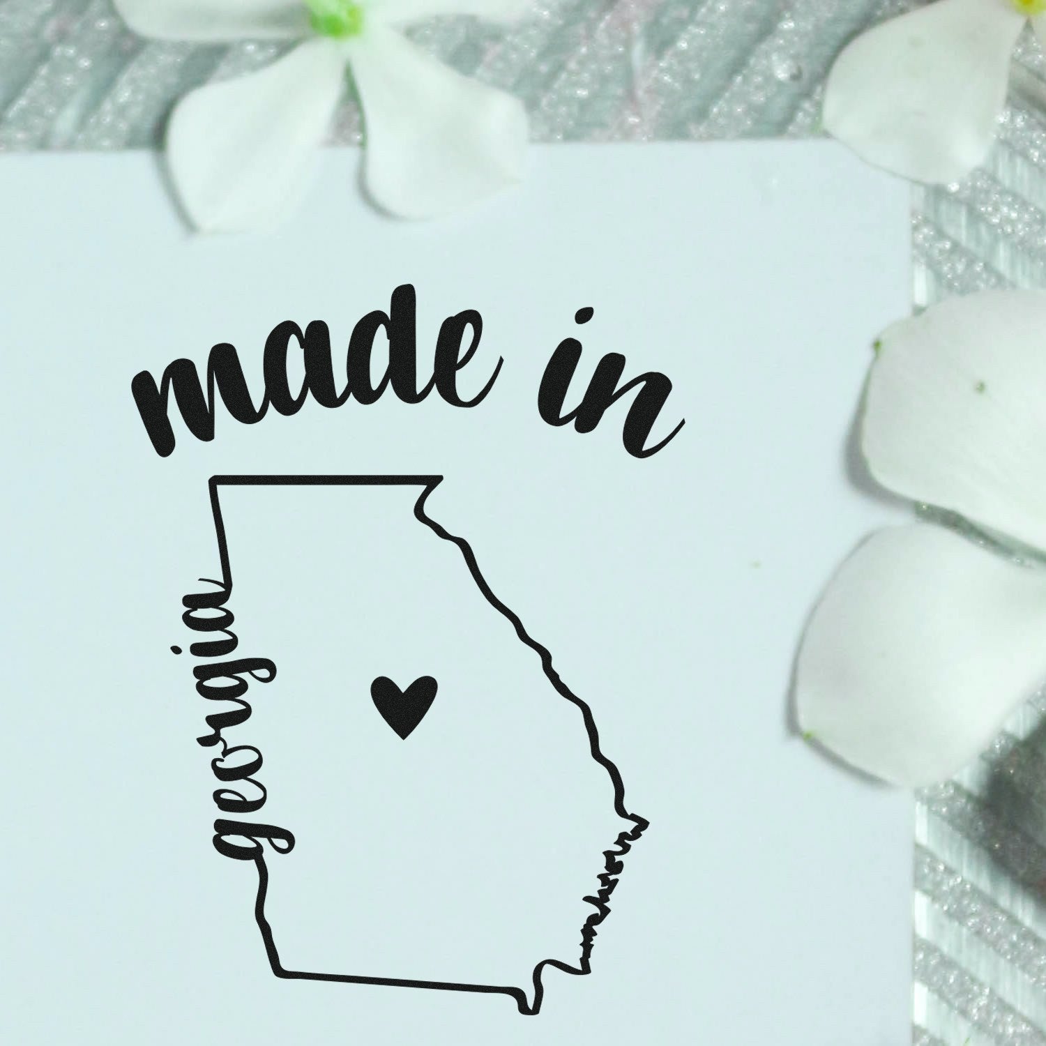 Made with Love in Georgia Rubber Stamp featuring a heart inside the state outline, surrounded by flowers on a textured background.