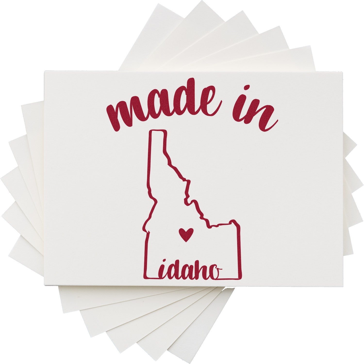 Made with Love in Idaho Rubber Stamp featuring a red outline of Idaho with a heart, and the words 'made in Idaho' on a stack of white cards.