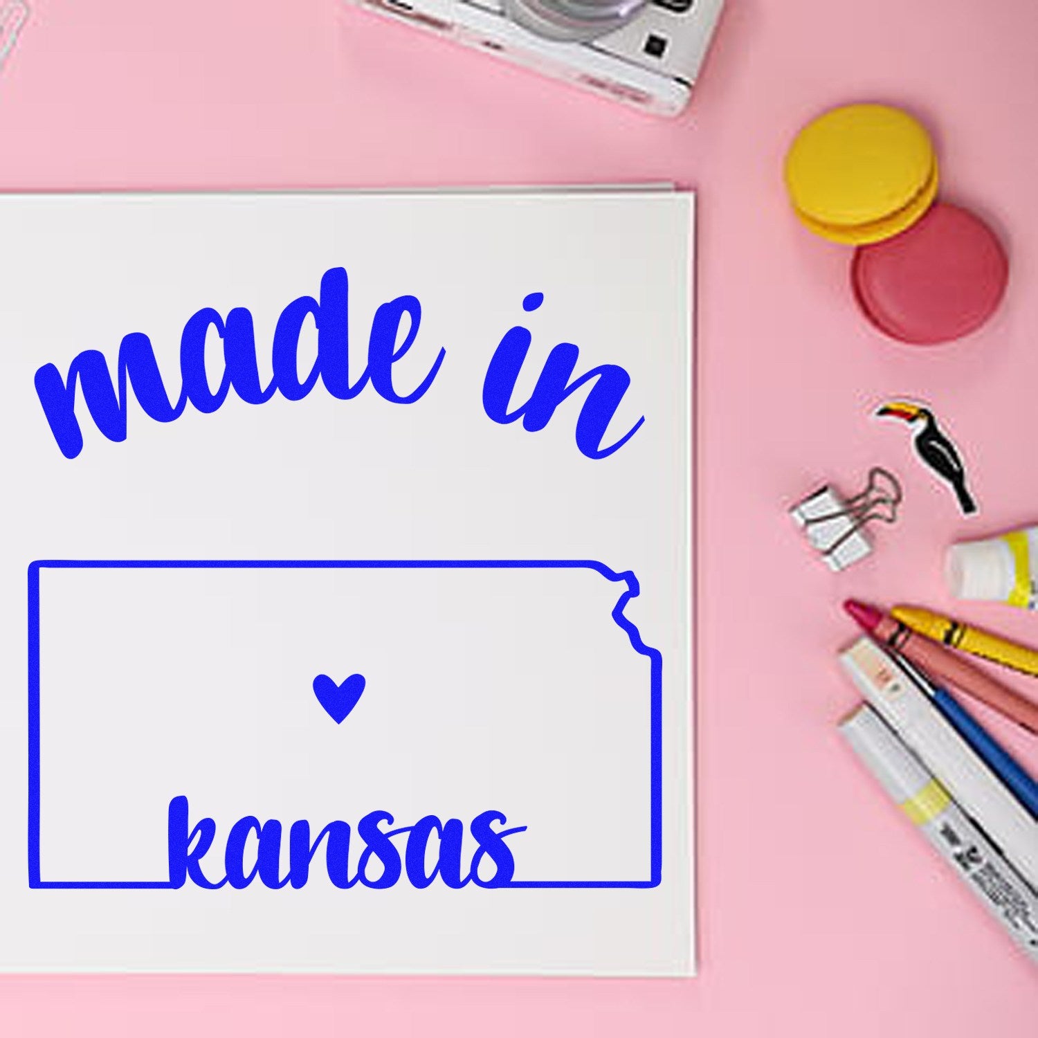 Self-Inking Handmade with Love in Kansas Stamp on a pink desk with stationery, featuring 'made in kansas' text and heart design. Perfect for crafts and gifts.