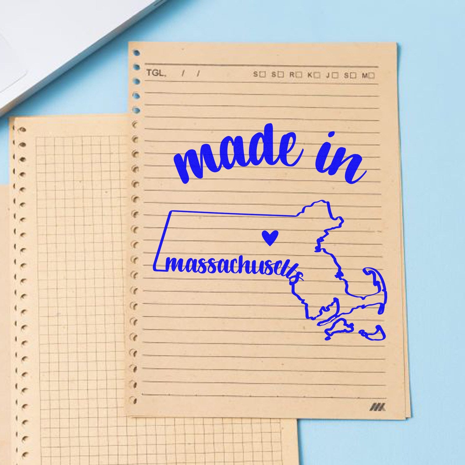 Made with Love in Massachusetts Rubber Stamp on lined paper, featuring a blue outline of Massachusetts with a heart, perfect for crafts and stationery.