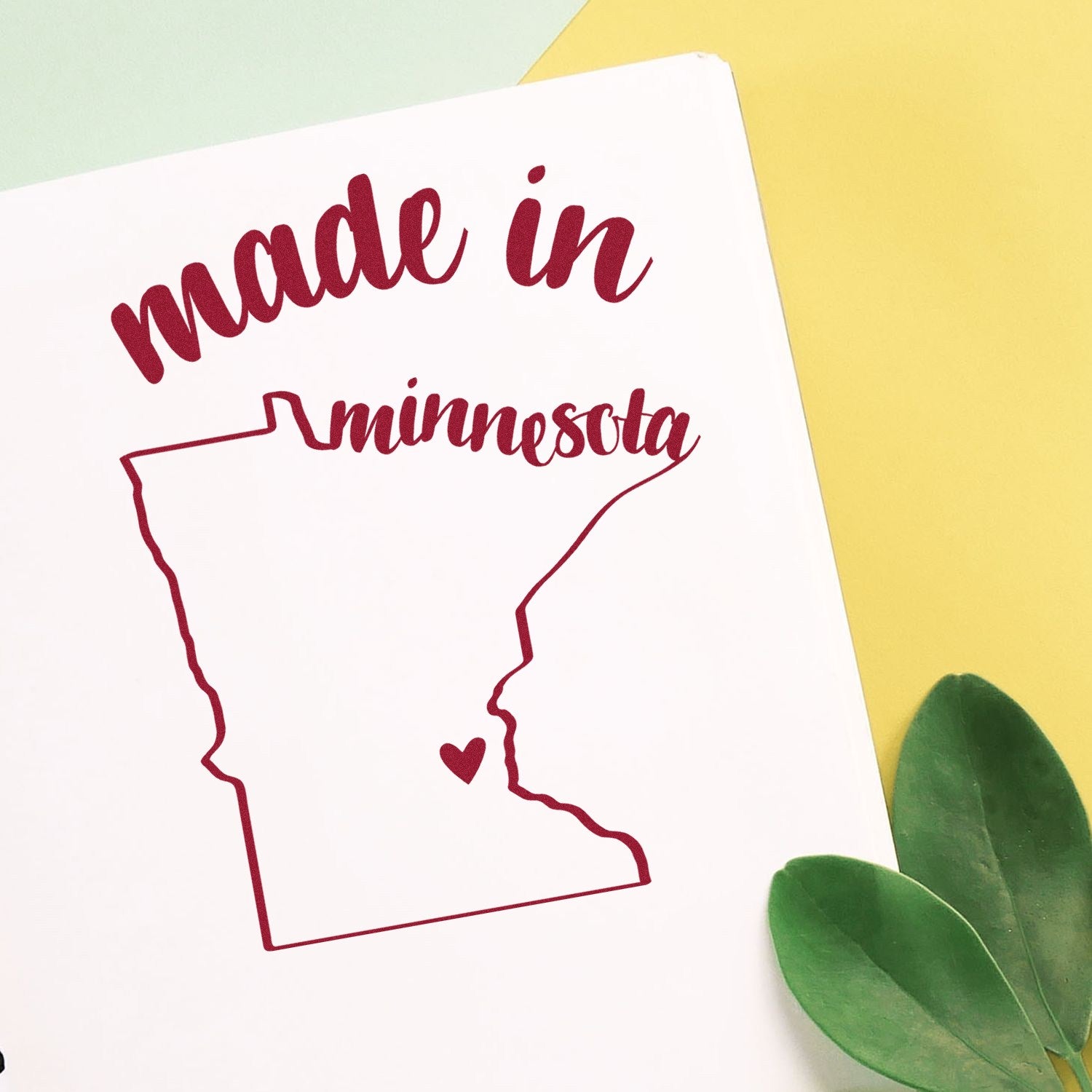 Self-Inking Handmade with Love in Minnesota Stamp featuring a red outline of Minnesota with a heart, perfect for crafts and gifts.