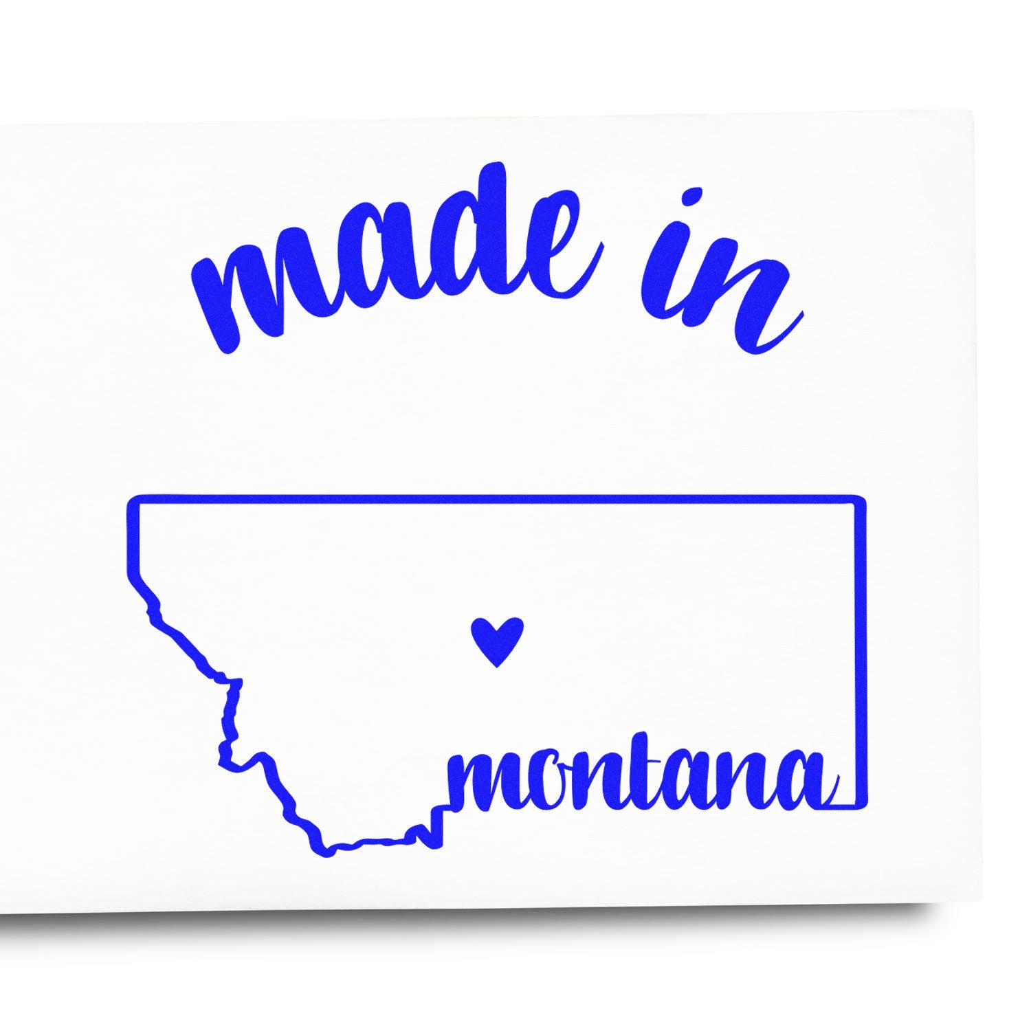 Made in Montana Stamp Pre-Inked featuring a blue outline of Montana with 'made in' above and 'montana' below, complete with a heart symbol inside the state outline.