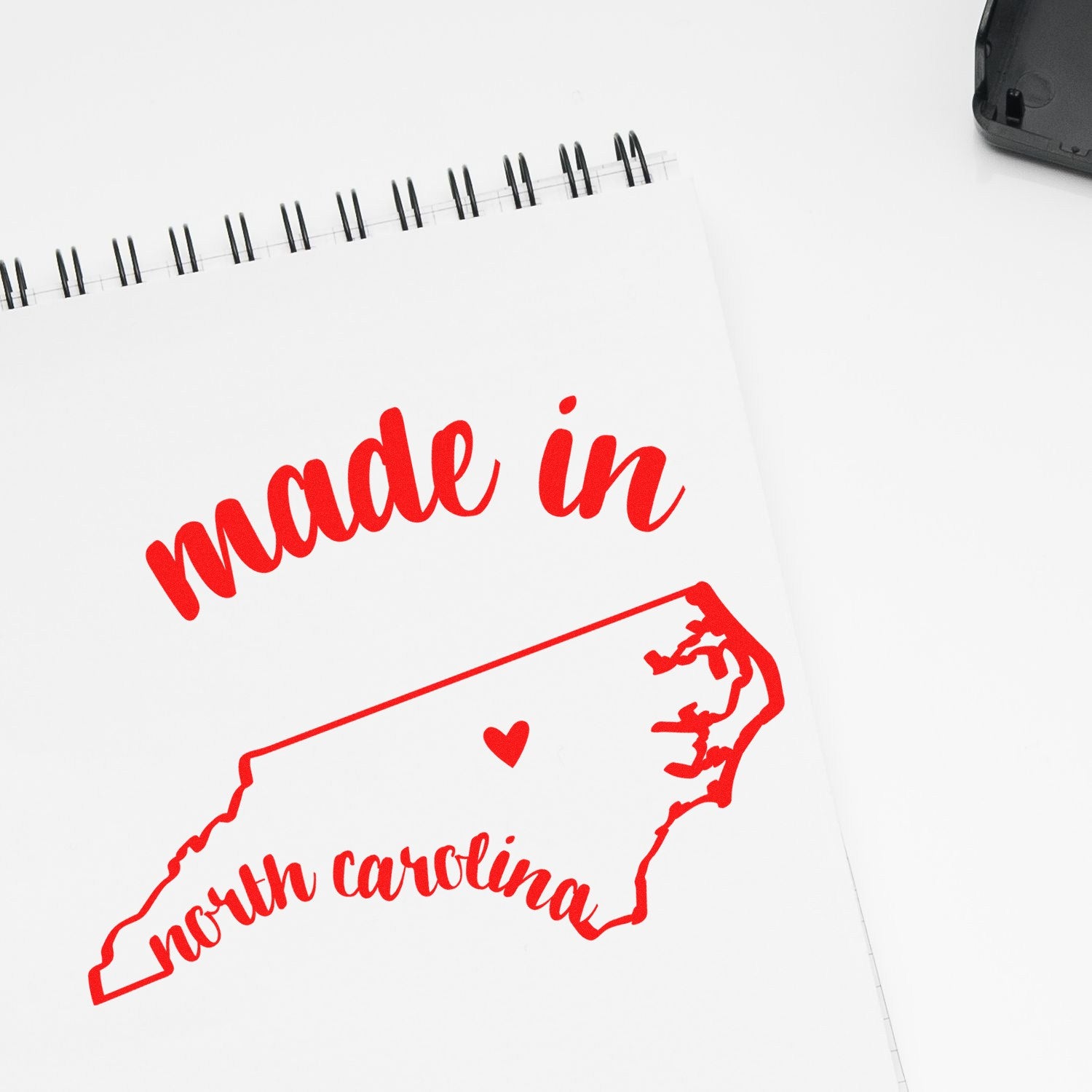 Slim Pre-Inked Stamp North Carolina Made in Stamp, featuring a red outline of North Carolina with 'made in' text, perfect for crafts and branding.