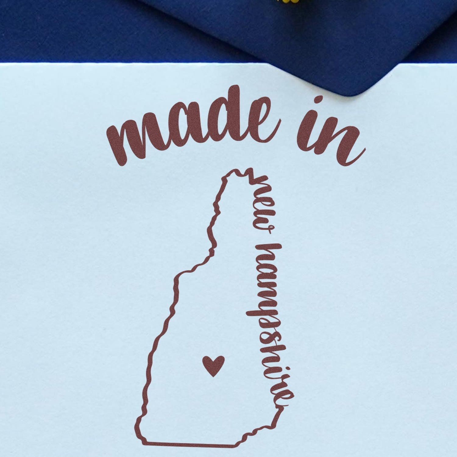 Self-Inking Handmade with Love in New Hampshire Stamp featuring a heart and state outline, perfect for crafts and gifts.