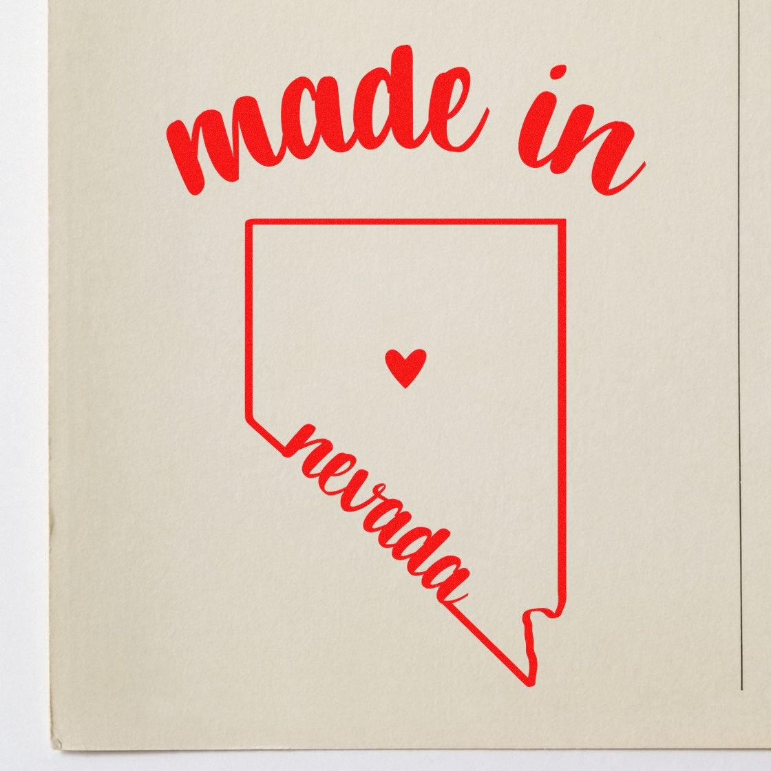 Self-Inking Handmade with Love in Nevada Stamp featuring a red outline of Nevada with a heart, and made in nevada text, perfect for crafts and gifts.