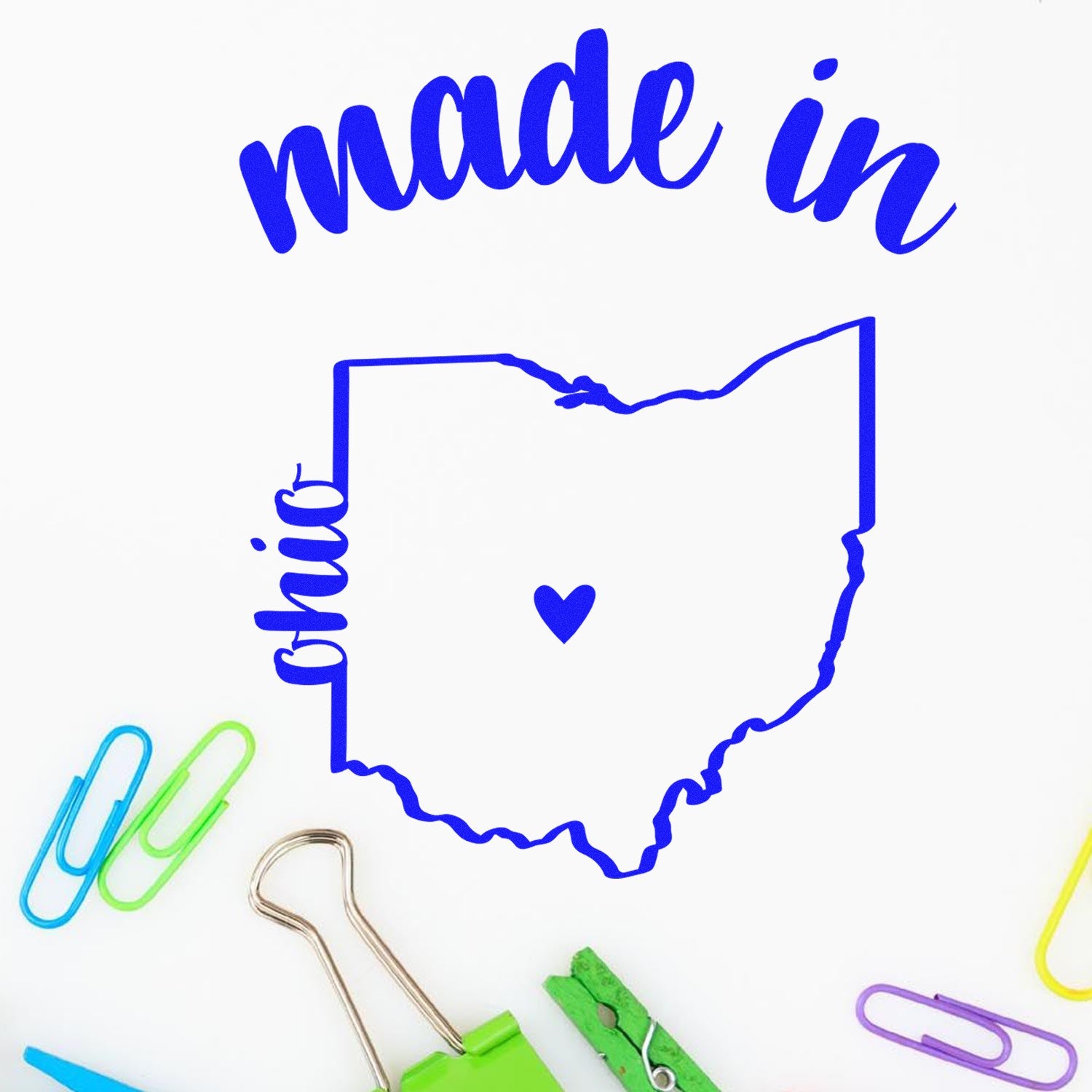 Made with Love in Ohio Rubber Stamp featuring a blue outline of Ohio with a heart, surrounded by colorful paper clips on a white background.