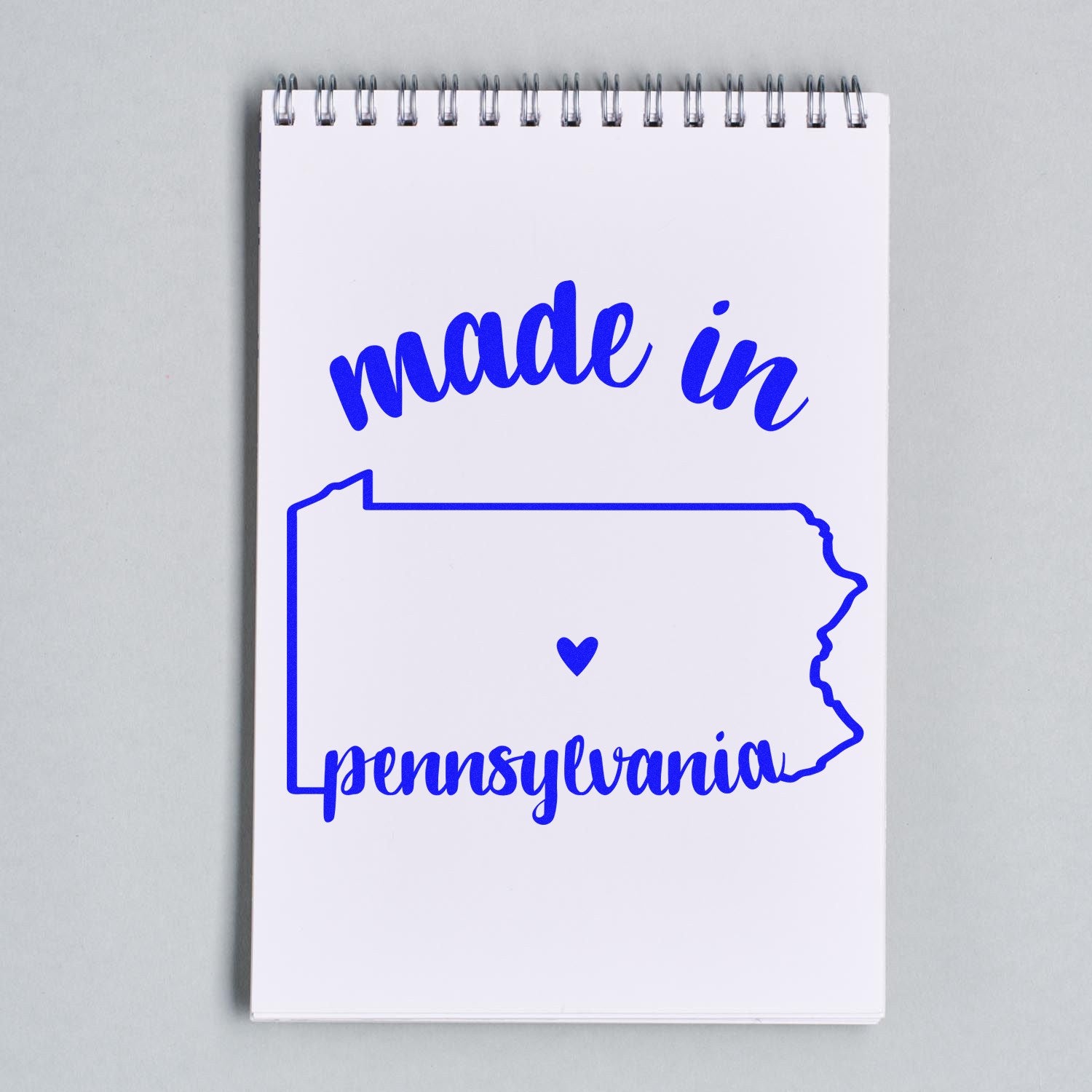 Made with Love in Pennsylvania Rubber Stamp on notepad, featuring blue text and state outline with heart, perfect for crafts and gifts.