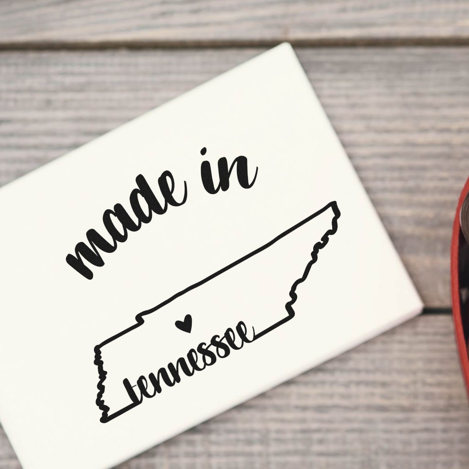 Self-Inking Handmade with Love in Tennessee Stamp featuring a map outline of Tennessee with 'made in' text, perfect for crafts and gifts. Black ink on a white background.