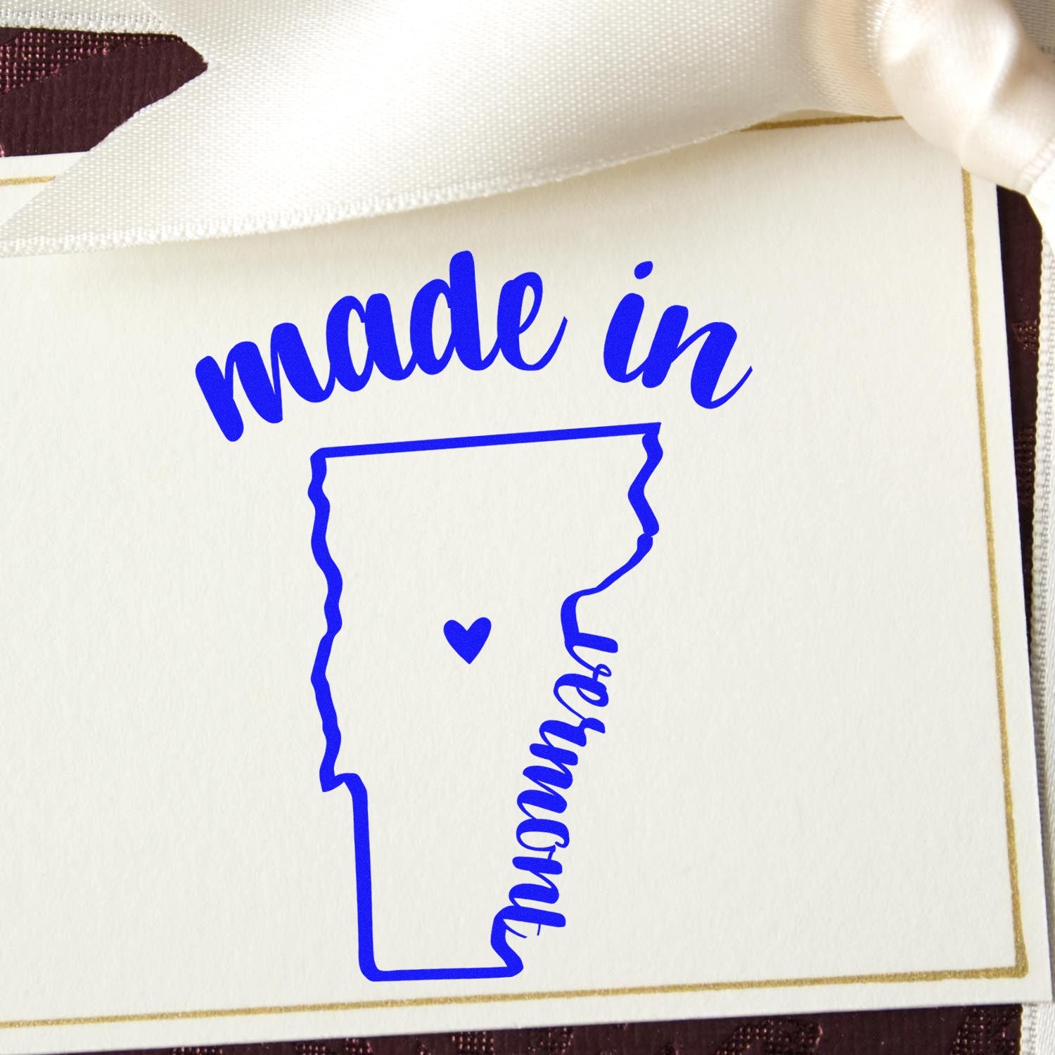 Made with Love in Vermont Rubber Stamp featuring a blue outline of Vermont with a heart, perfect for crafts and gifts. Ideal for adding a personal touch to your projects.