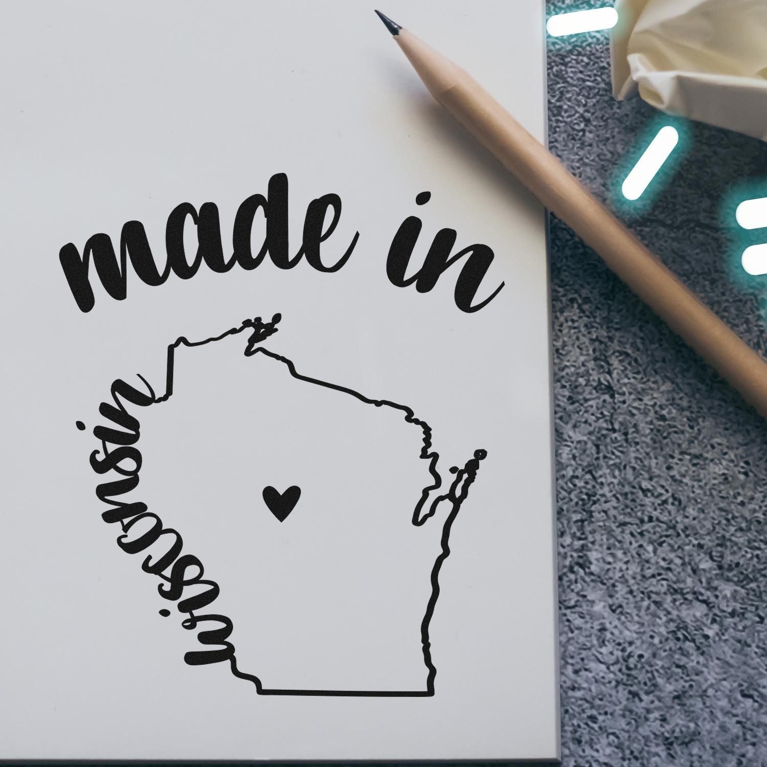 Self-Inking Handmade with Love in Wisconsin Stamp featuring a heart and 'made in Wisconsin' text, perfect for crafts and gifts. Includes a map outline of Wisconsin.