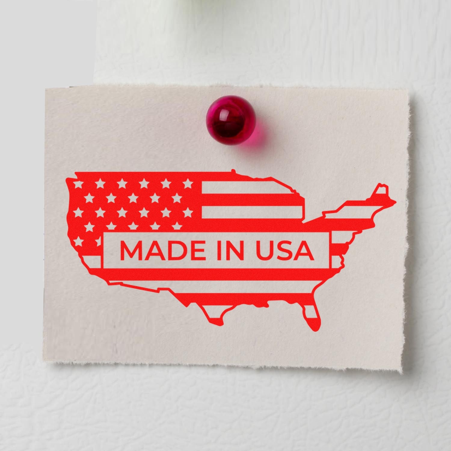 Slim Pre-Inked Patriotic USA Seal Stamp featuring a red map of the USA with stars and stripes, and Made in USA text, pinned on a white surface. Perfect for patriotic branding.