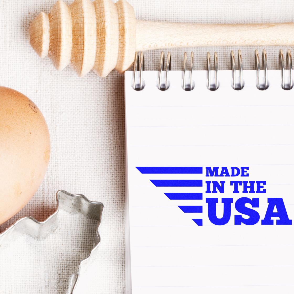 Wood Handle Patriotic and Proud Rubber Stamp with Made in the USA design, featuring a wooden handle and blue ink, perfect for adding a patriotic touch to crafts and documents.