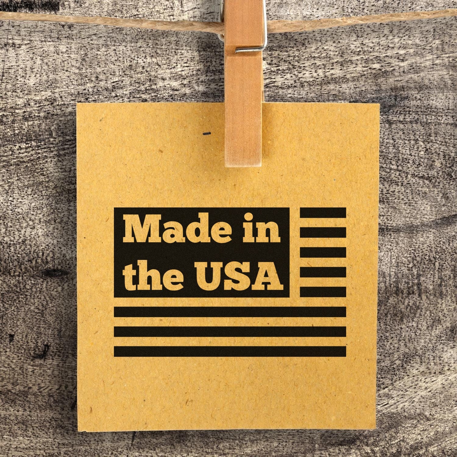 PSI Pre-Inked Patriotic Pride Made in the USA Stamp on a wooden background, featuring bold black text and stripes on a brown card, symbolizing American craftsmanship.