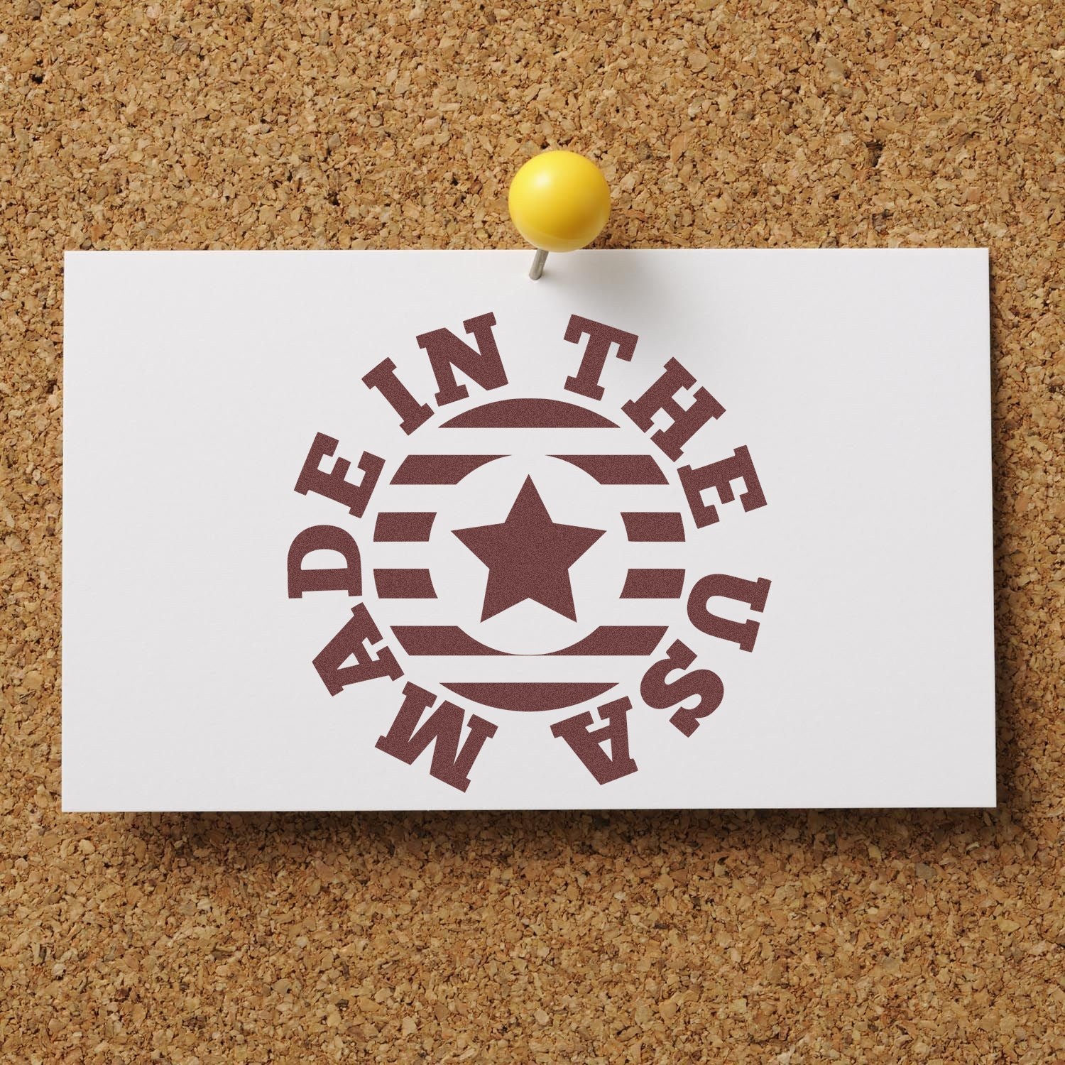 Self-Inking Made In The USA Star Emblem Stamp on a corkboard, featuring a circular design with a central star and bold text, ideal for patriotic branding and crafts.