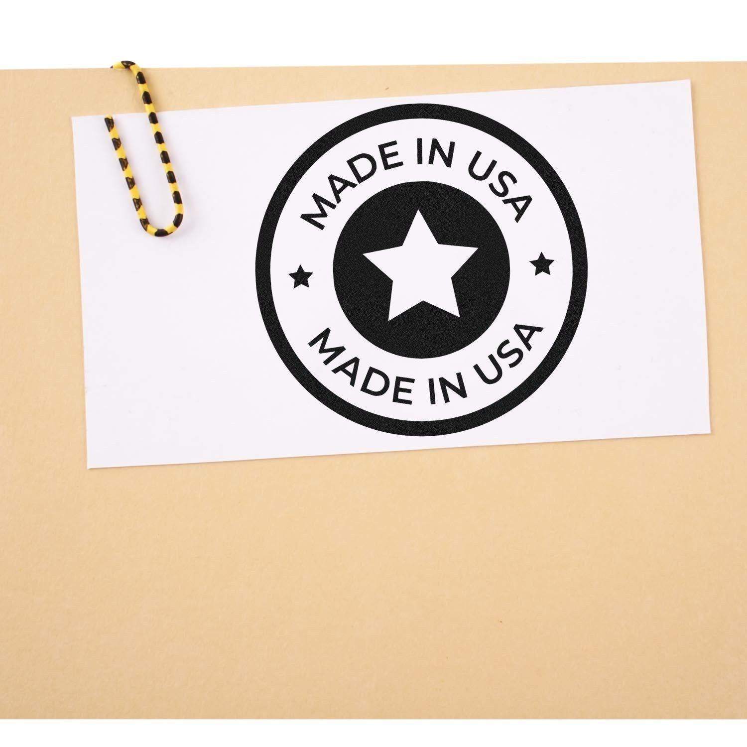 Wood Handle Our Country Craftsmanship Seal Rubber Stamp on a beige surface, featuring a Made in USA design with a star in the center, showcasing quality craftsmanship.