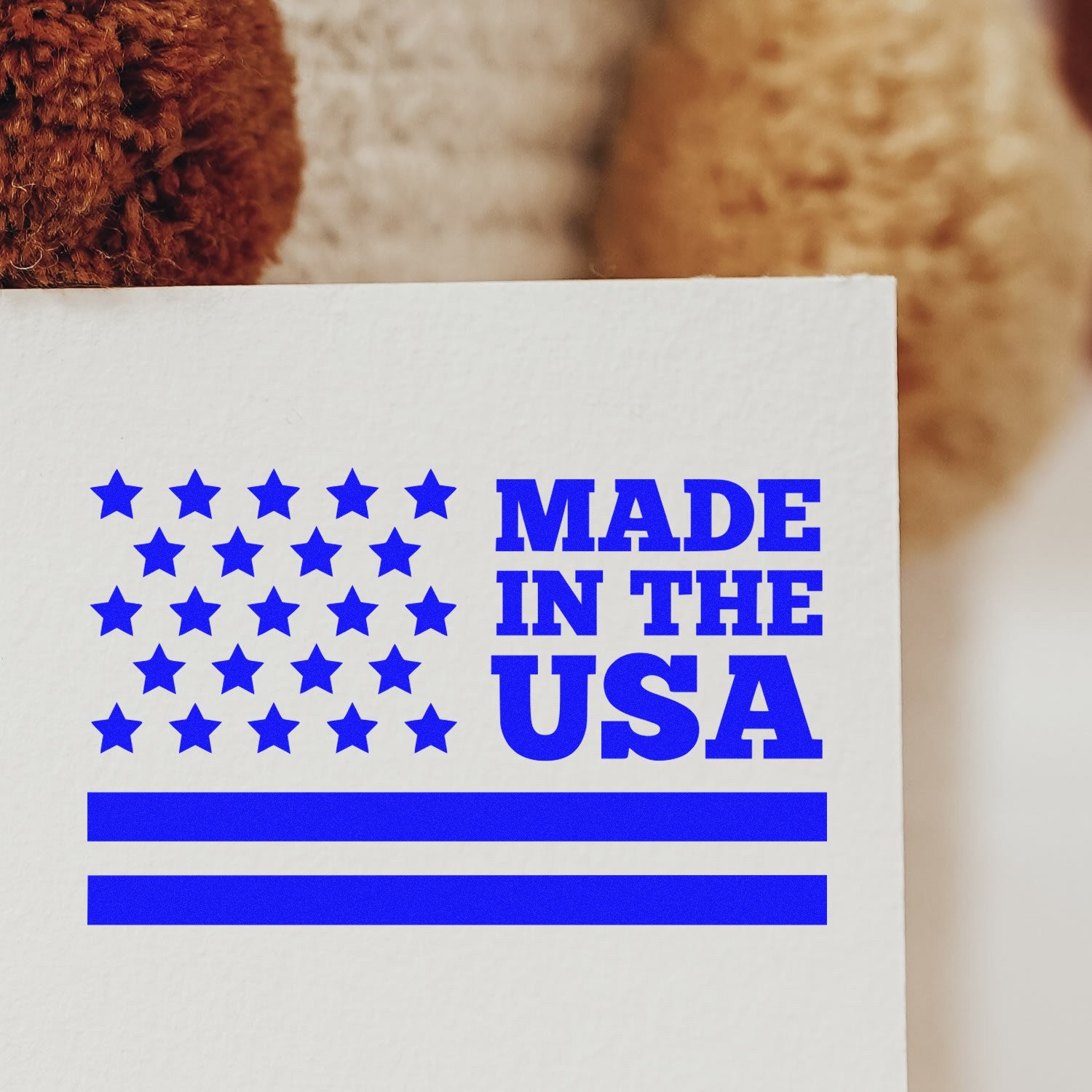 Slim Pre-Inked Patriot Pride Stamp Stamp featuring a bold blue Made in the USA design with stars and stripes, perfect for adding a patriotic touch to documents and crafts.