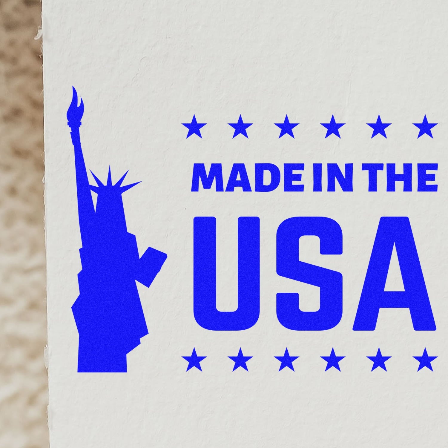 Self-Inking Liberty Made In The USA Stamp featuring a blue Statue of Liberty silhouette and 'Made in the USA' text, ideal for patriotic branding and marking.