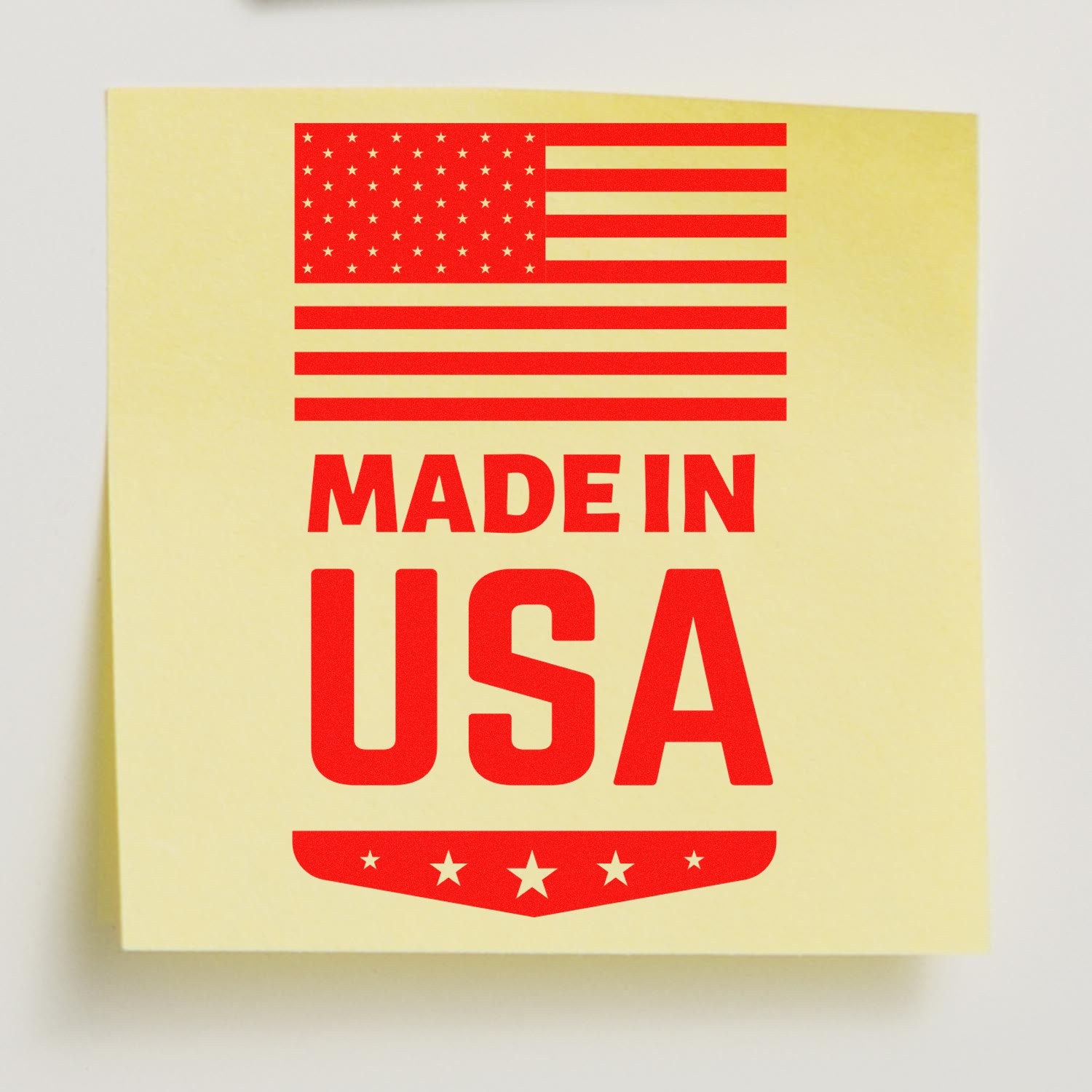 Wood Handle Made In USA Emblem Rubber Stamp featuring a red Made in USA design with stars and stripes on a yellow background. Perfect for adding a patriotic touch to crafts and documents.