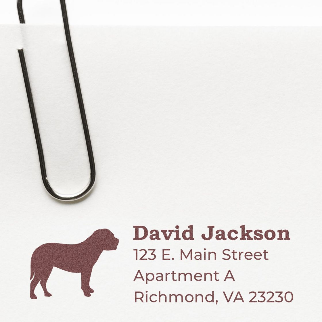 Bullmastiff Silhouette Address Rubber Stamp on white paper with a paperclip. Features a bullmastiff silhouette and personalized address details in brown ink.