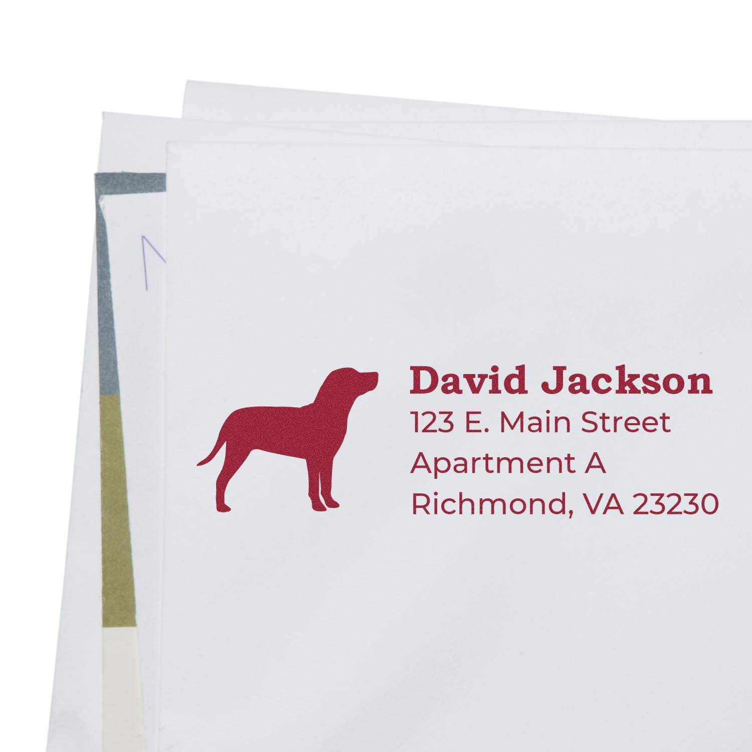 Slim Pre-Inked Catahoula Address Stamp in use, featuring a red Catahoula dog silhouette and personalized address on white envelopes.