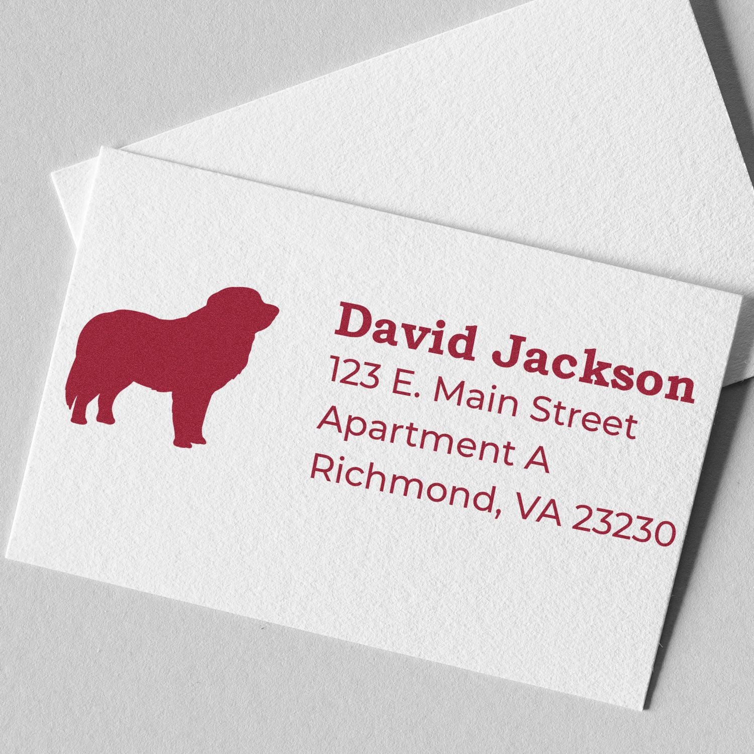 Self-Inking Pyrenees Dog Address Stamp on a white card with red text and a silhouette of a Pyrenees dog, displaying an address in a clean, elegant design.