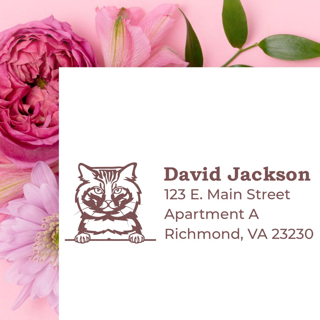 PSI Pre-Inked Peeking American Bobtail Cat Personalized Address Stamp on white paper, surrounded by pink flowers. The stamp features a cat illustration with customizable address text.