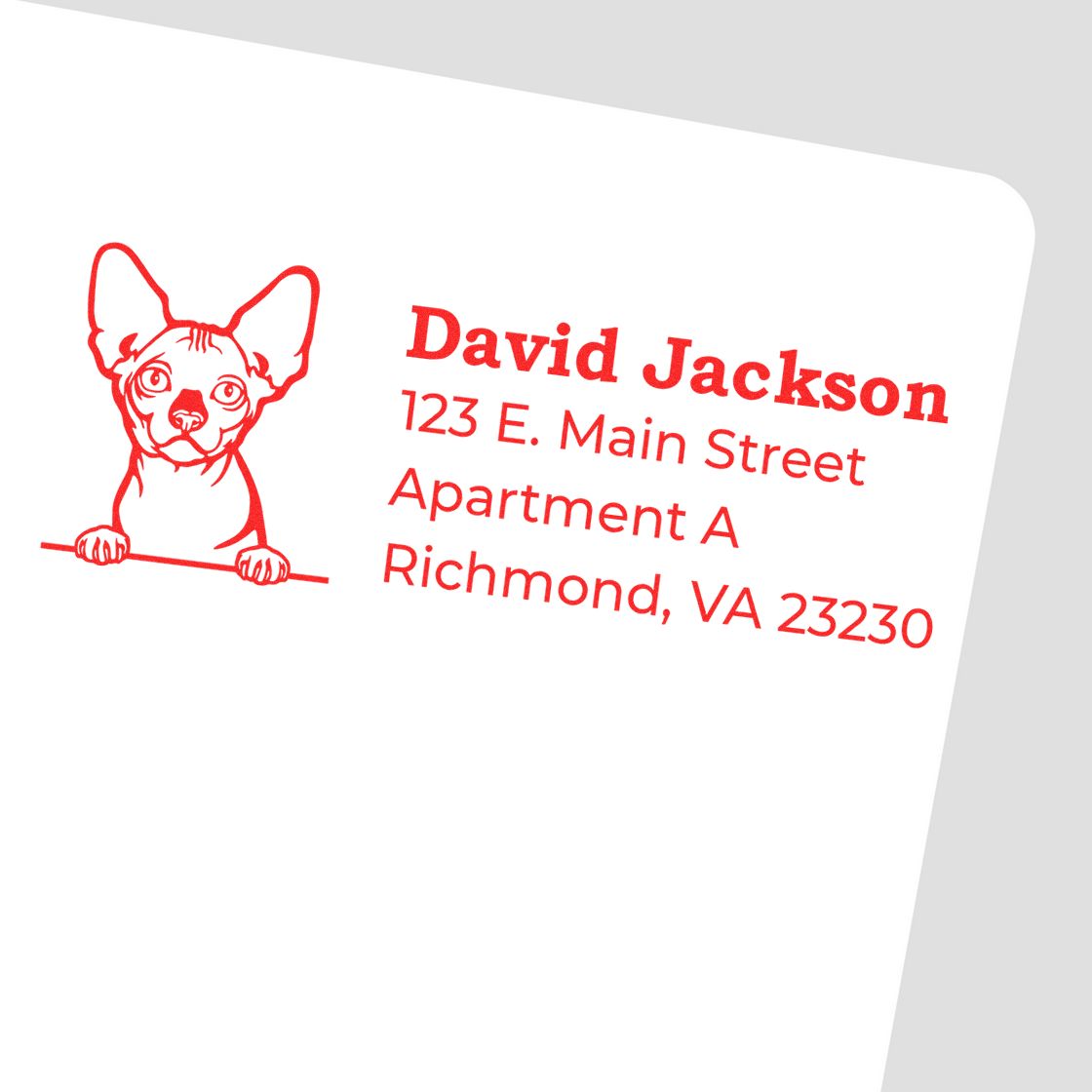 Red self-inking Bambino custom address stamp featuring a cute dog illustration and sample address text in bold red font on a white background.