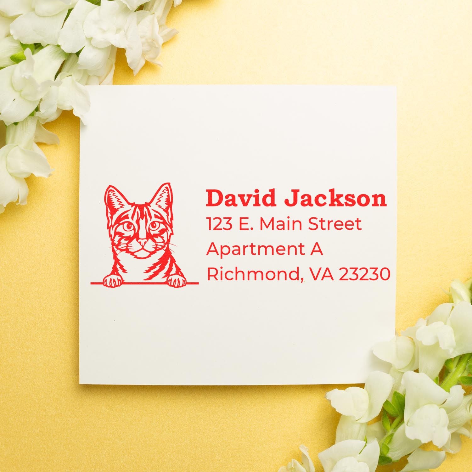 Self-Inking Egyptian Mau Custom Address Stamp on white card with red cat design and address text, surrounded by white flowers on a gold background.