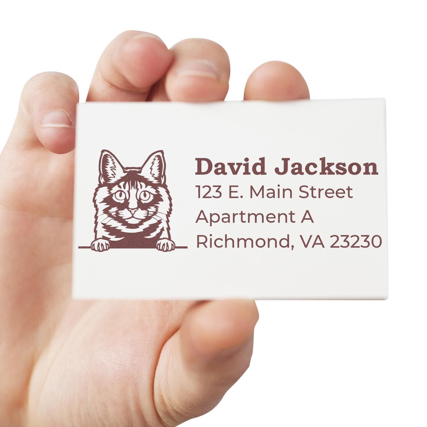 Hand holding a card stamped with a Kurilian Bobtail cat design and address details using the Self-Inking Kurilian Bobtail Custom Address Stamp.